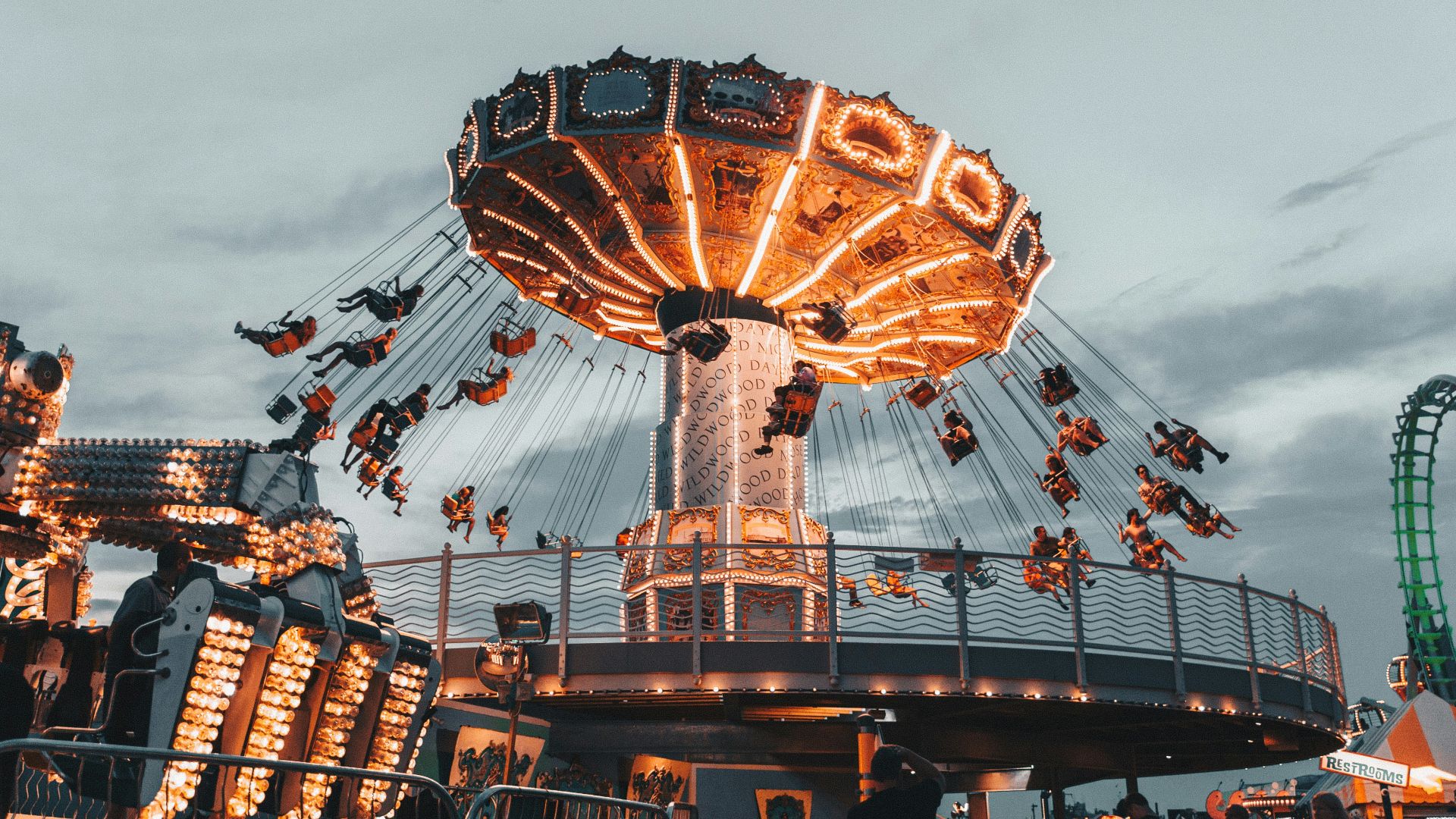 people riding amusement park ride