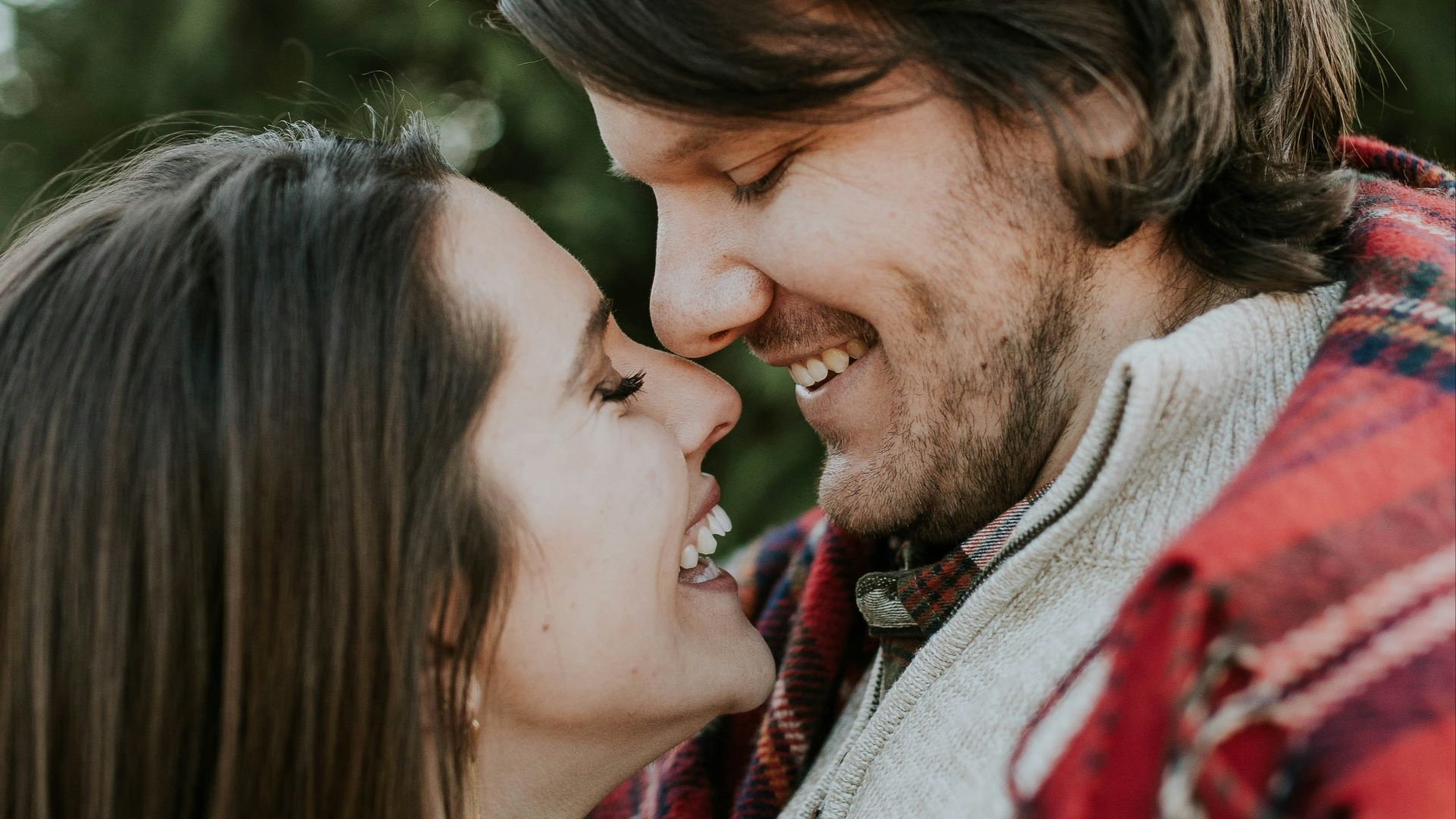 man and woman laughing at each other
