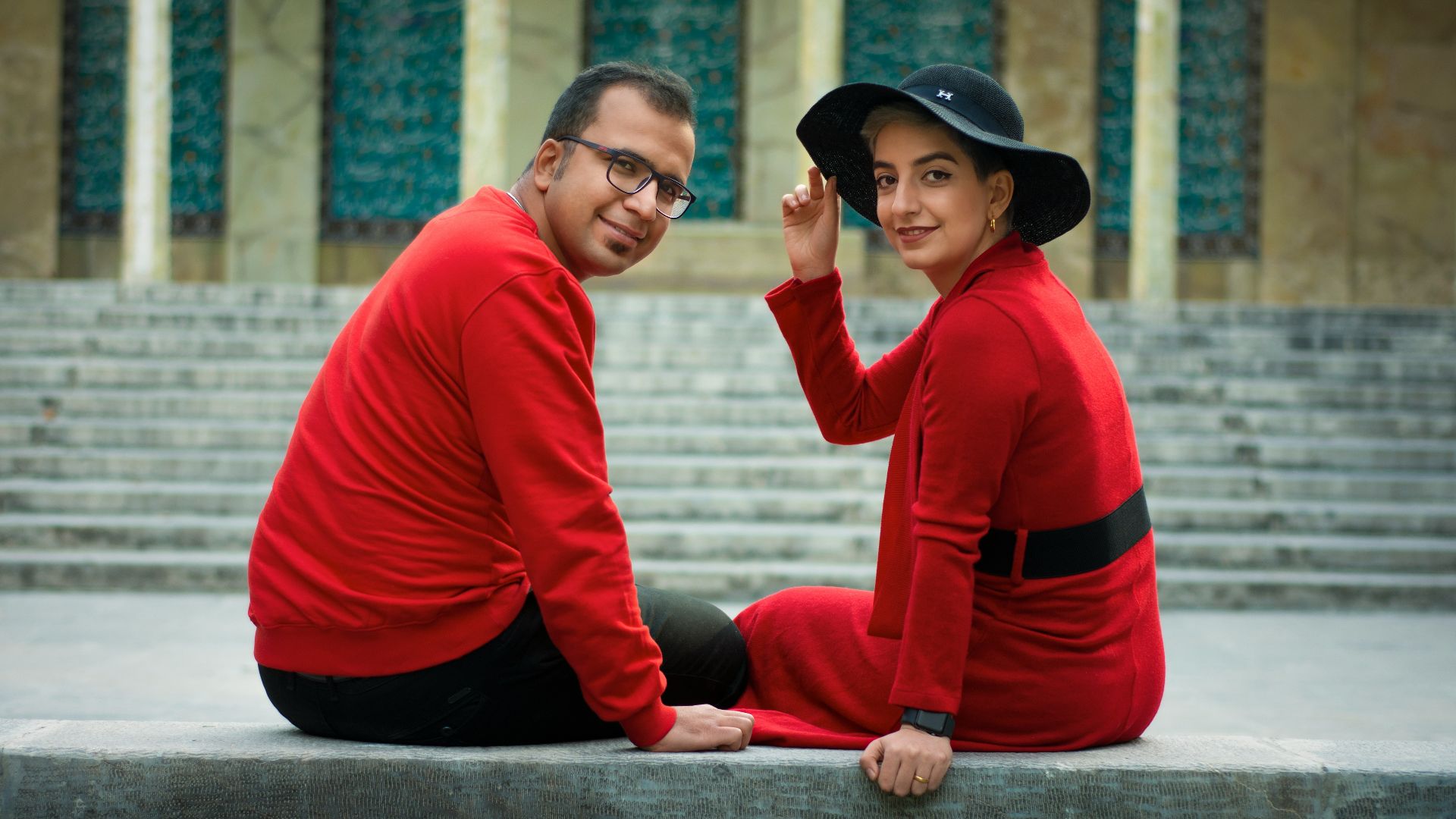 man in red and black long sleeve shirt and black hat