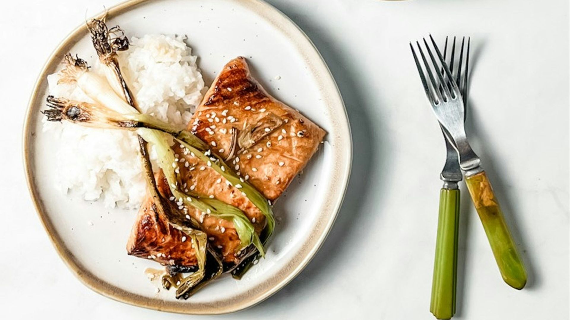 two plates of food on a white table