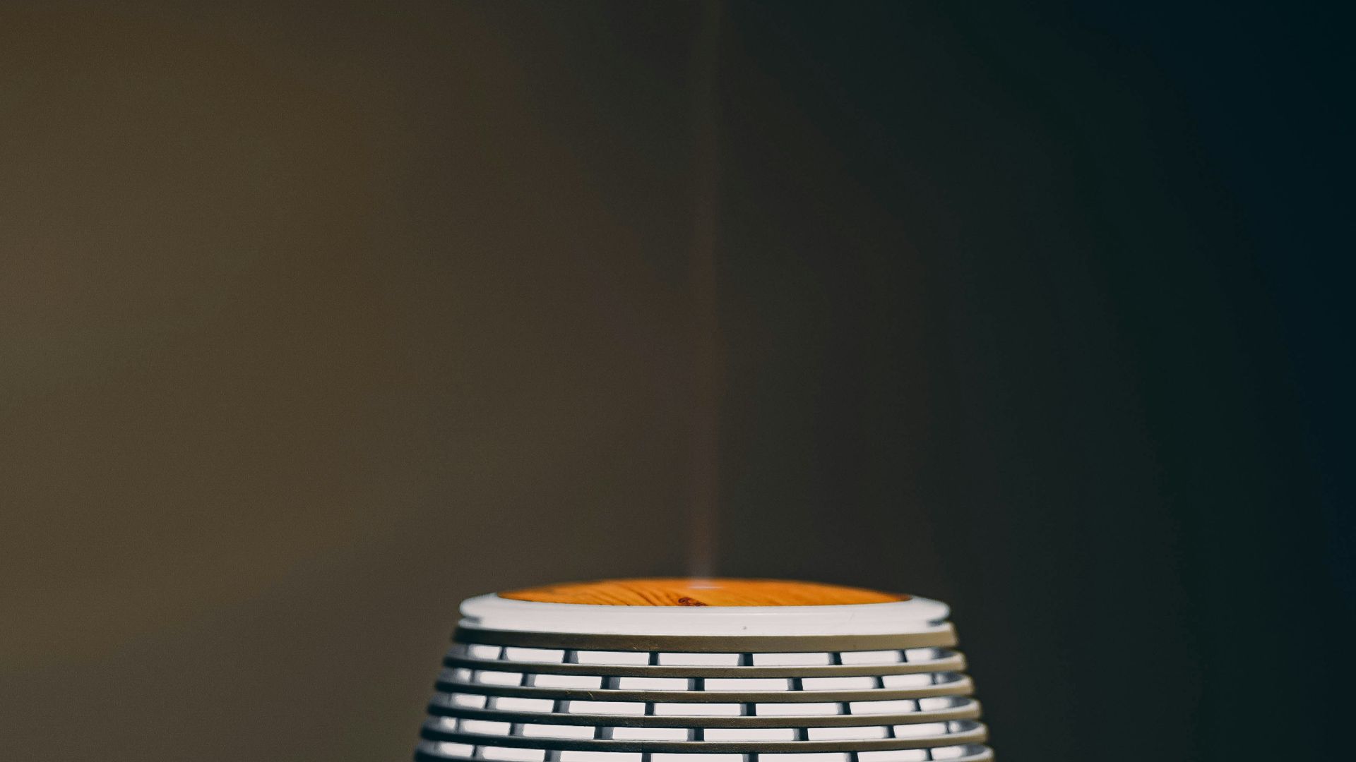 a white cup with steam rising out of it