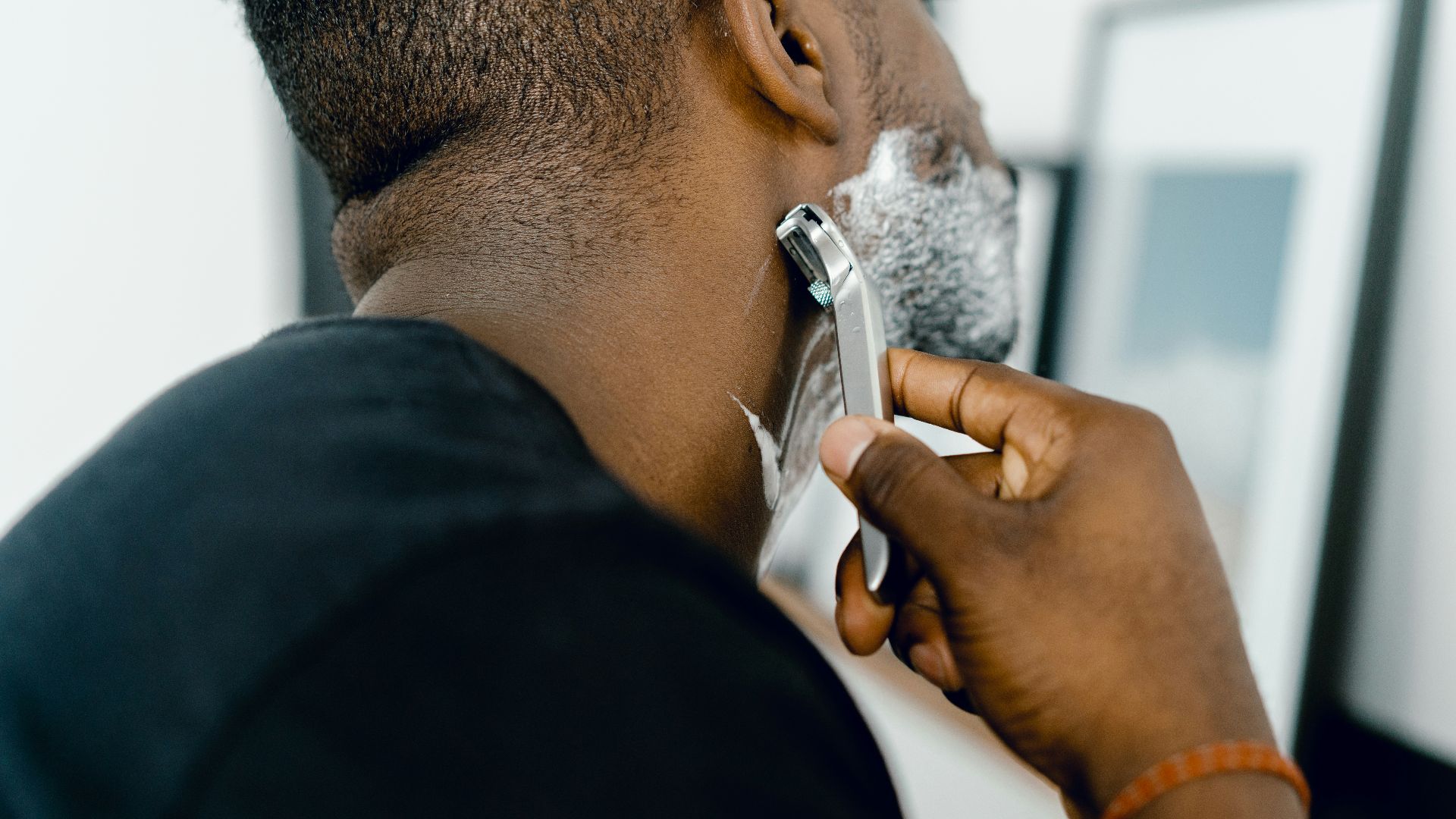 man shaving himself