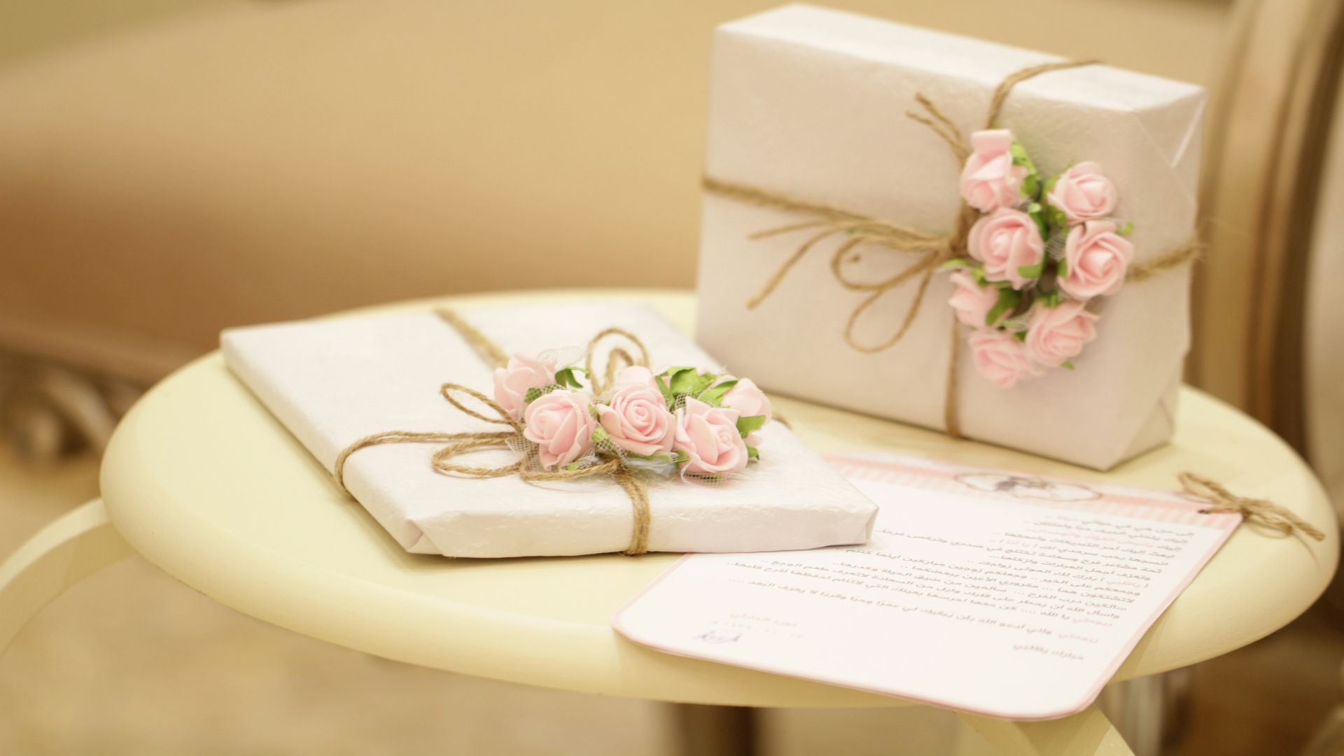 two pink and white floral boxes