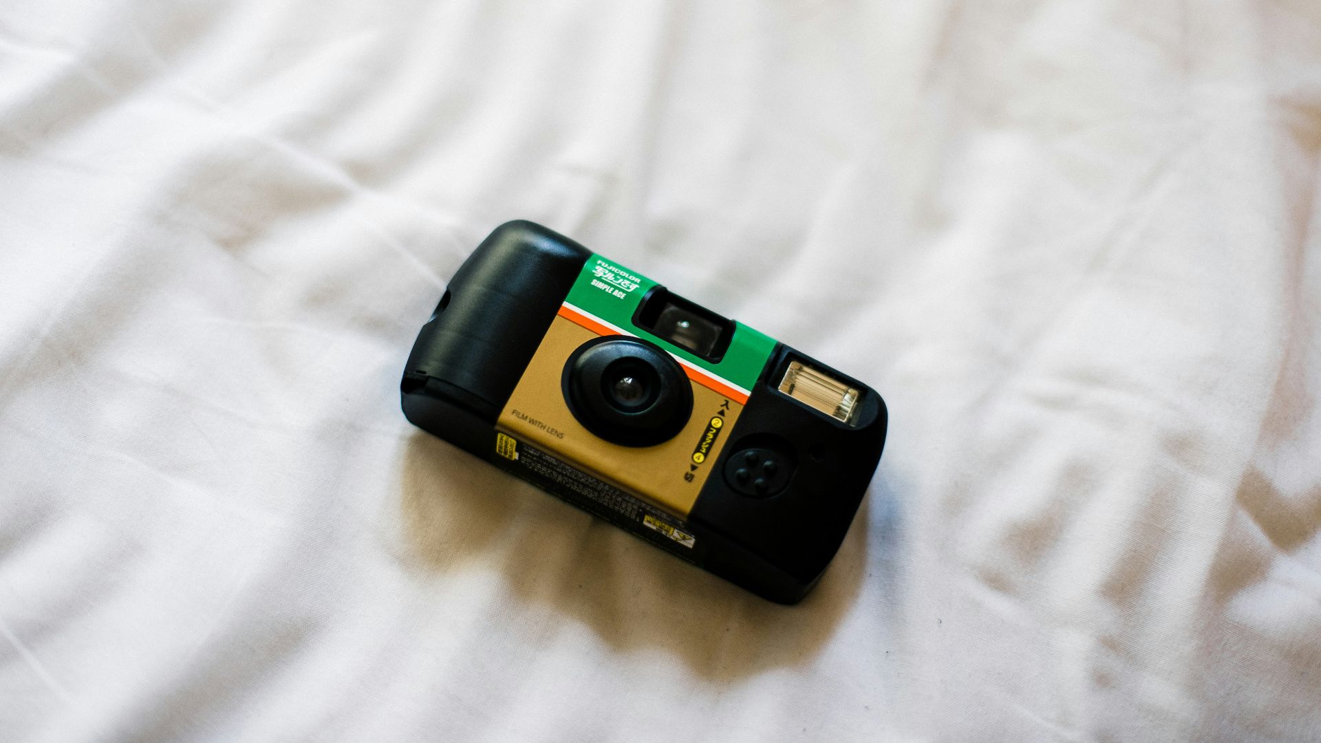 black and green point and shoot camera
