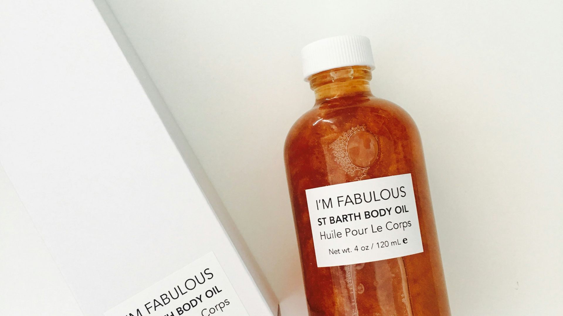 brown glass bottle beside box