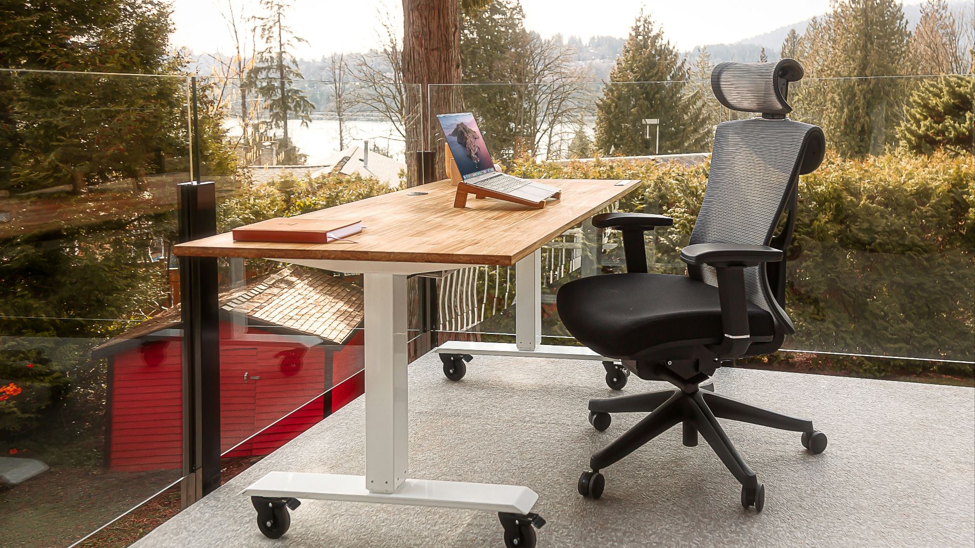 a desk with a laptop on top of it