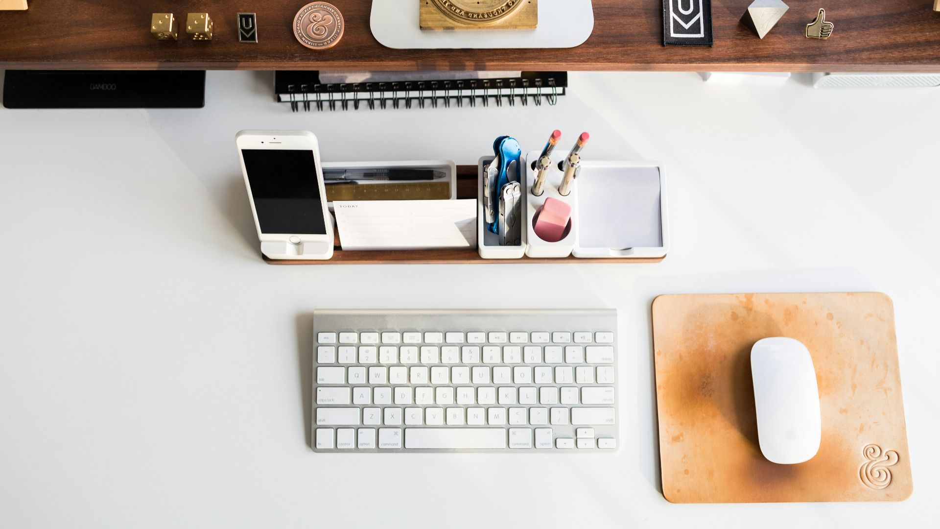 white Apple mouse beside keyboard