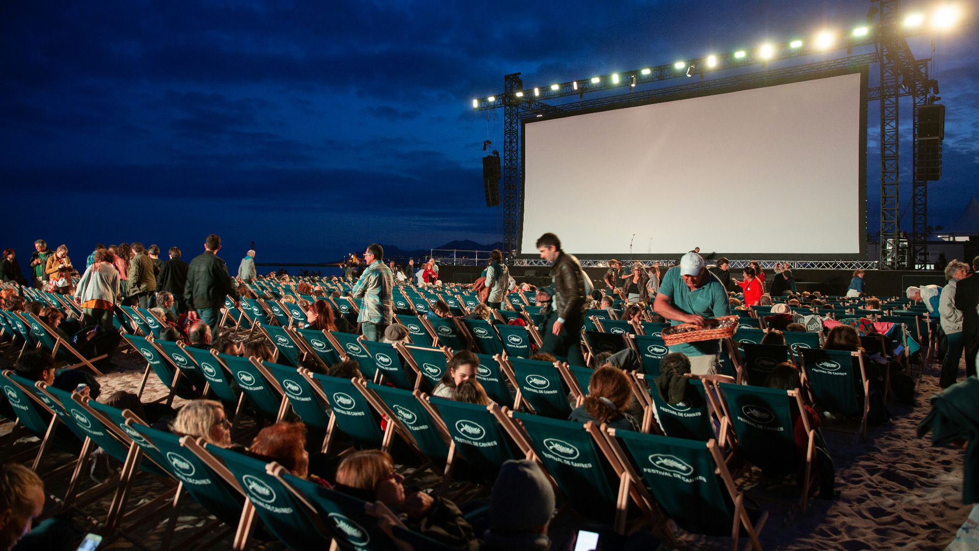 group of people sitting on raw gray chairs