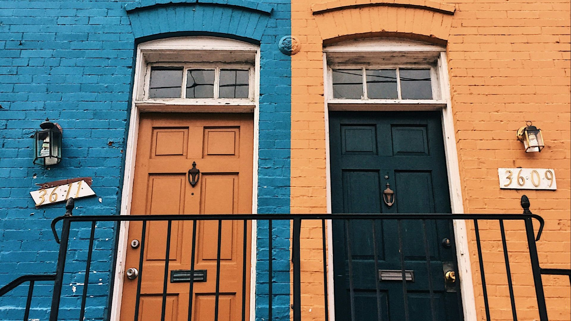 a blue building with a black door