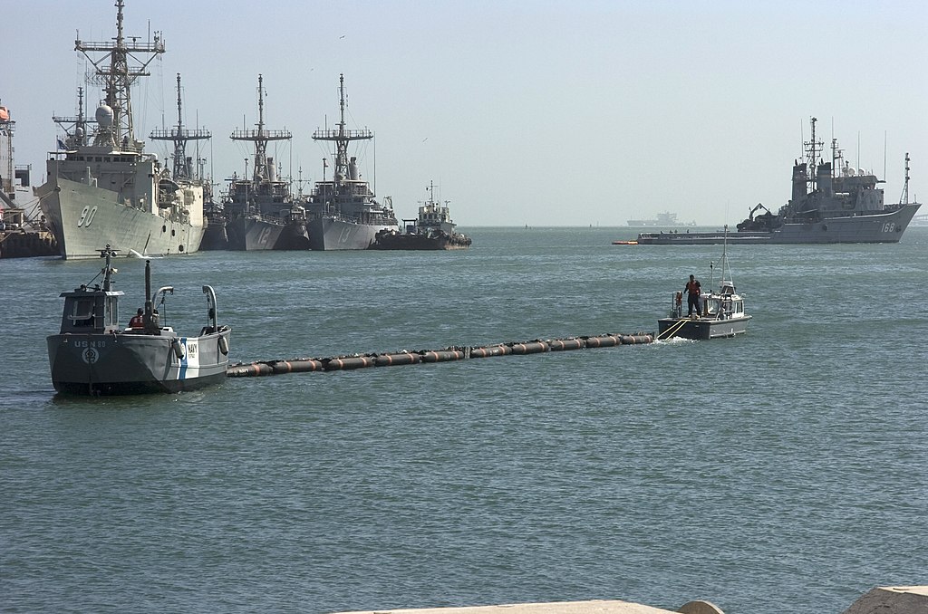 Us Navy 071106-N-8135W-005 A Boom Tow Boat Pulls An Open-Ocean Boom Used To Collect Oil Floating In The Water And Deliver It To The Wide-Body Skimmer Vessel, Left, To Remove The Oil From The Surface Of T