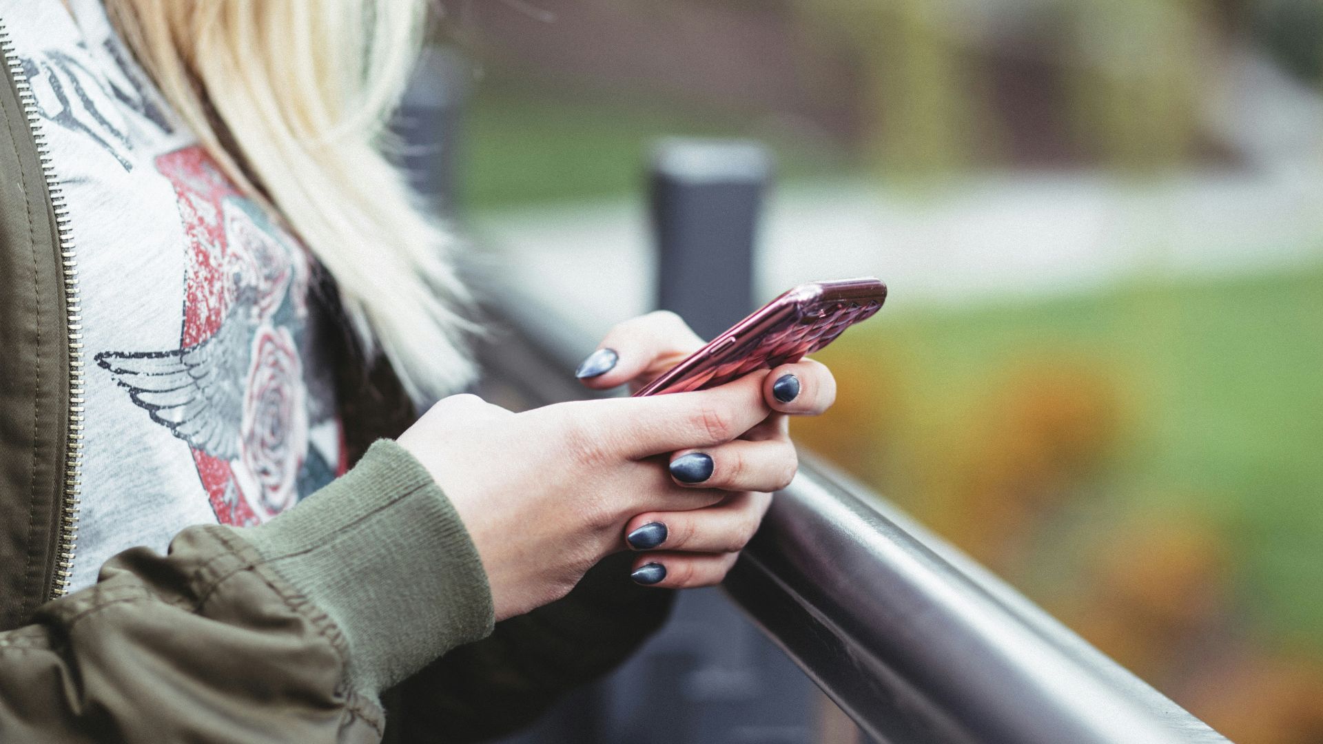 woman holding red phone