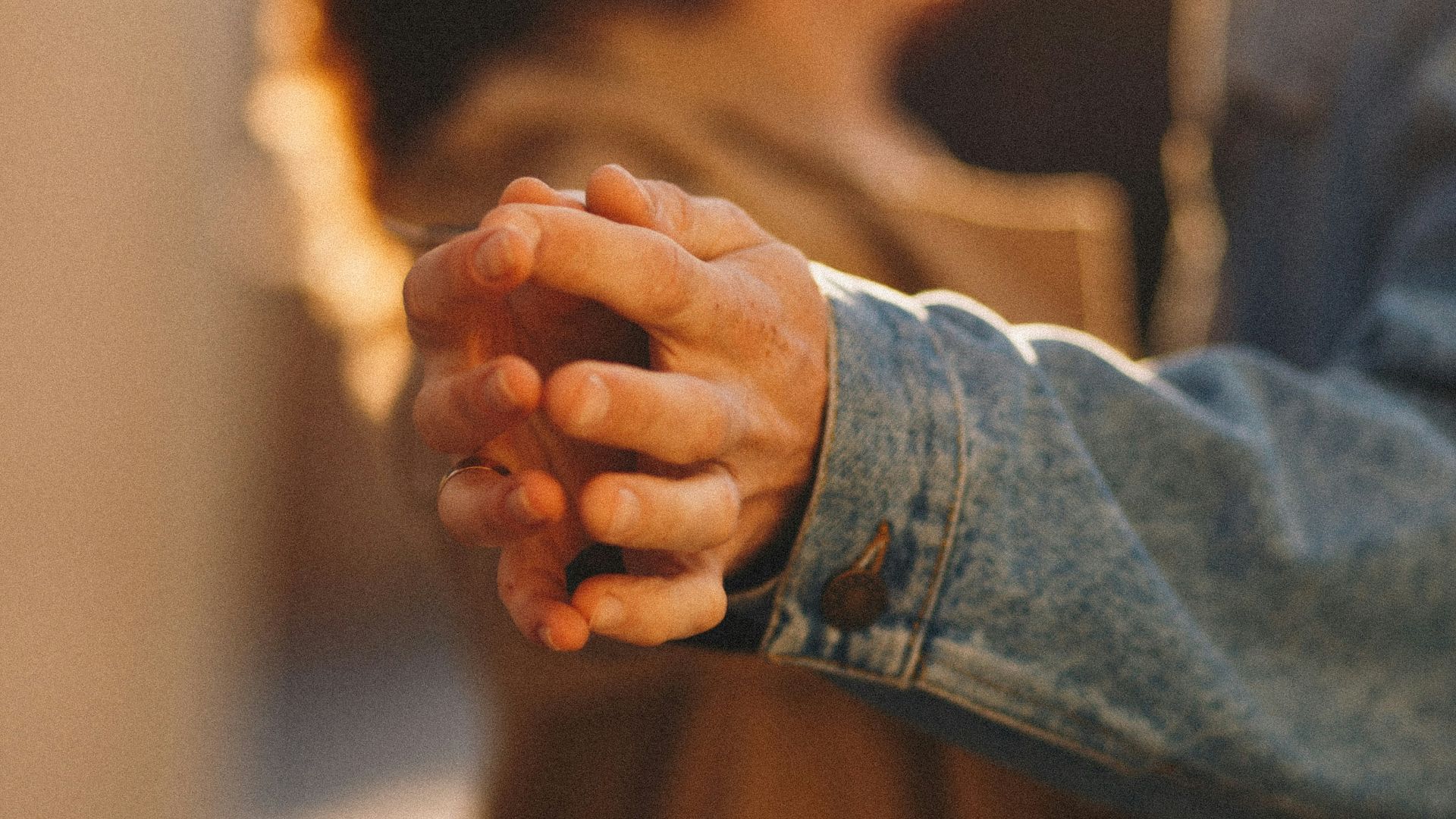 person in blue denim jacket