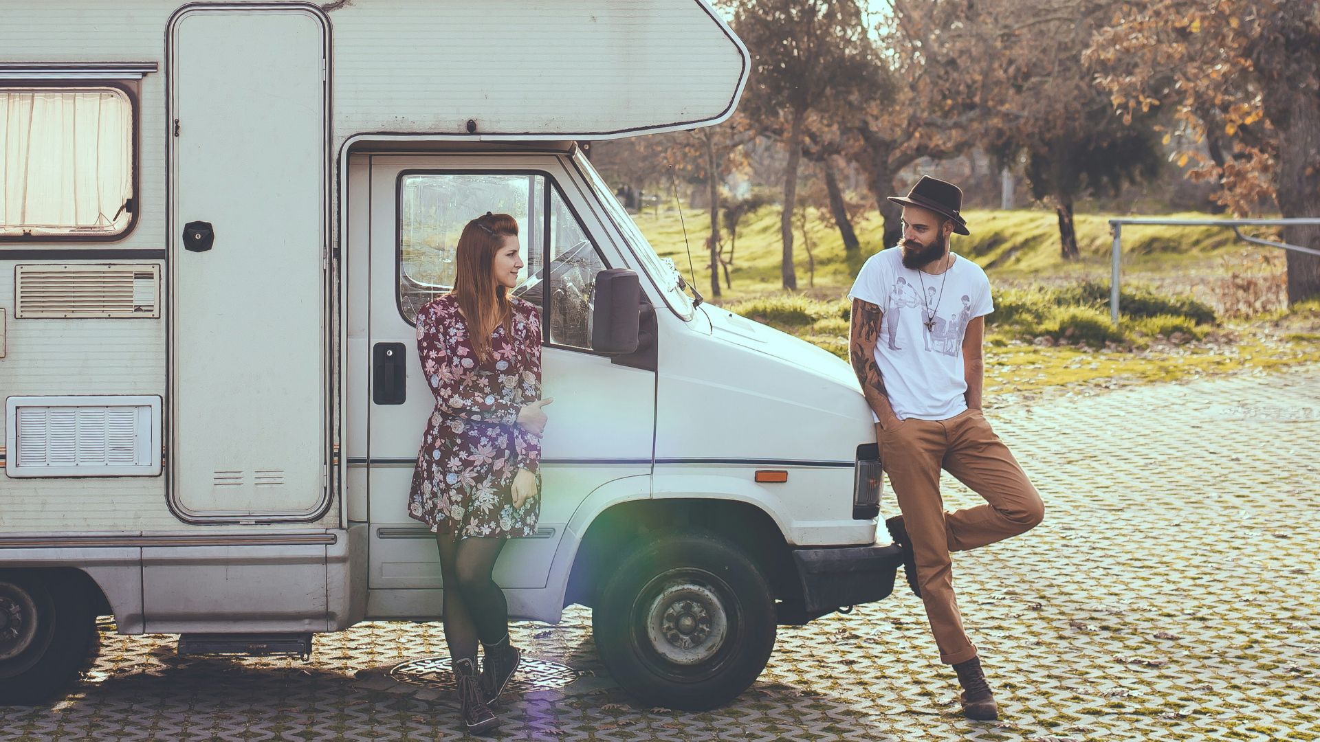 man and woman lying on truck