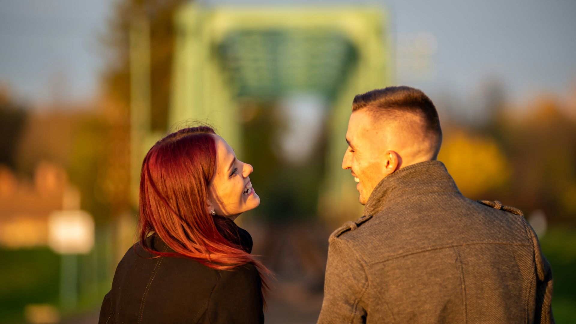 man and woman standing side by side during daytime