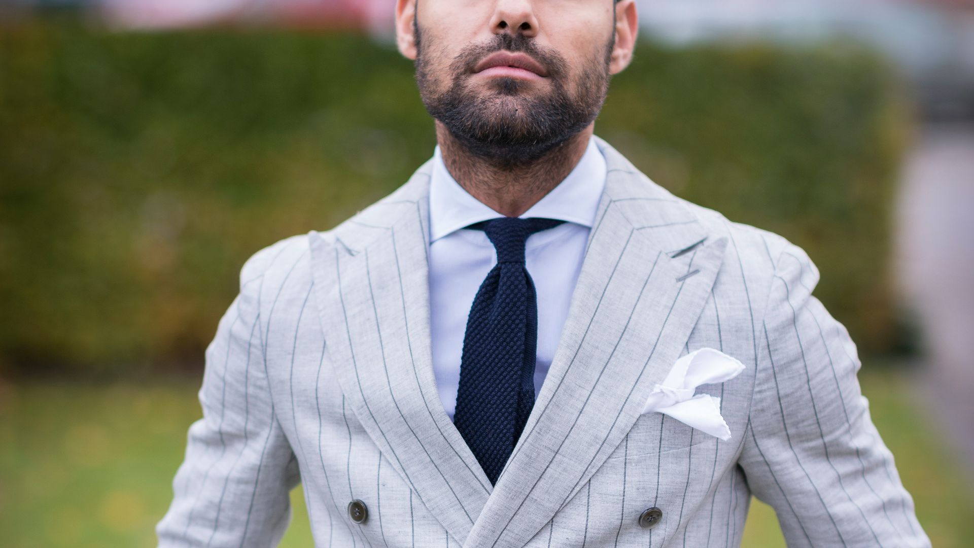 man in white and black pinstripe suit jacket