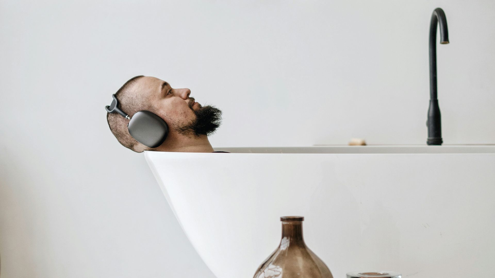 brown glass bottle on white table