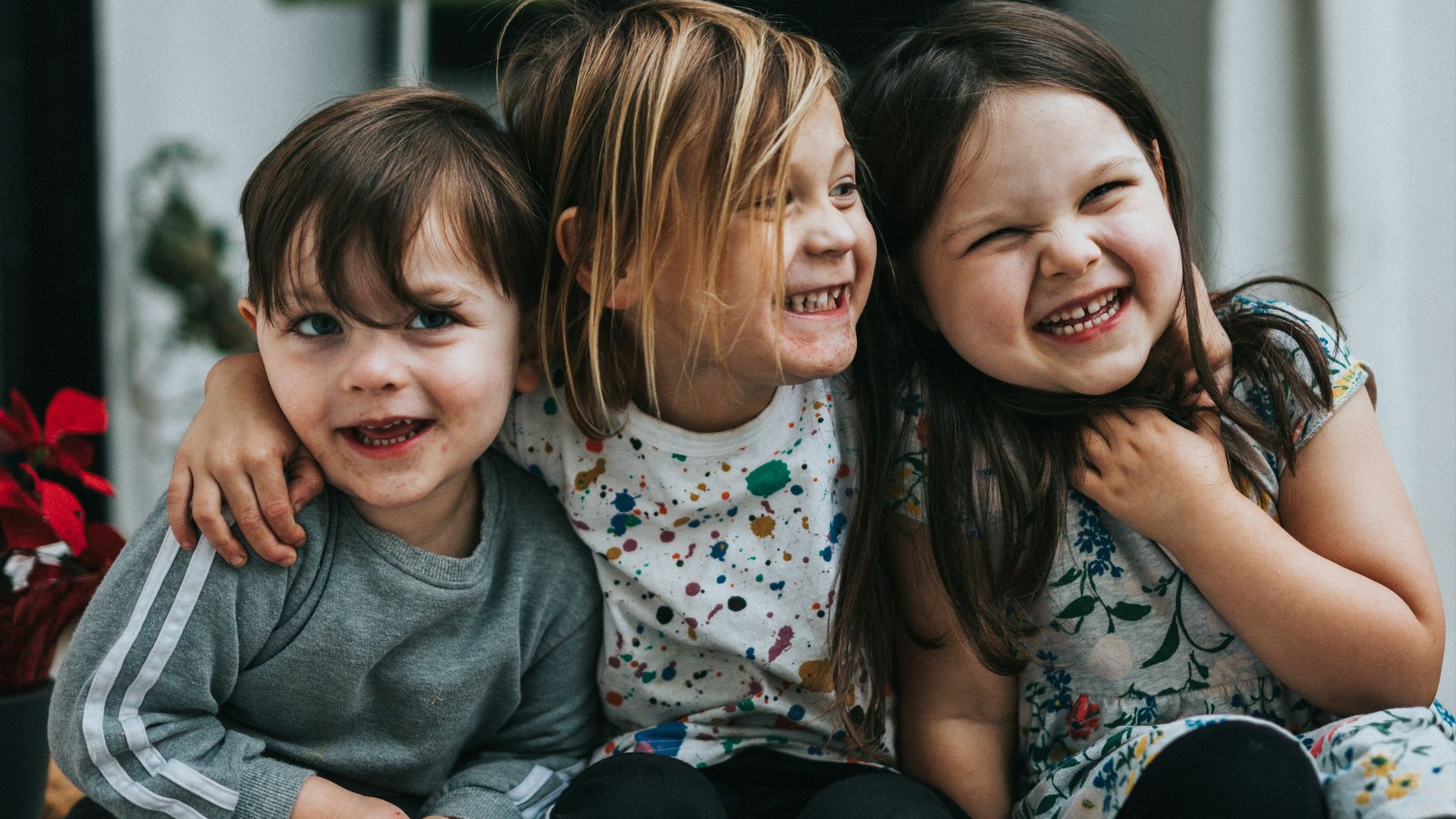 2 girls sitting on floor