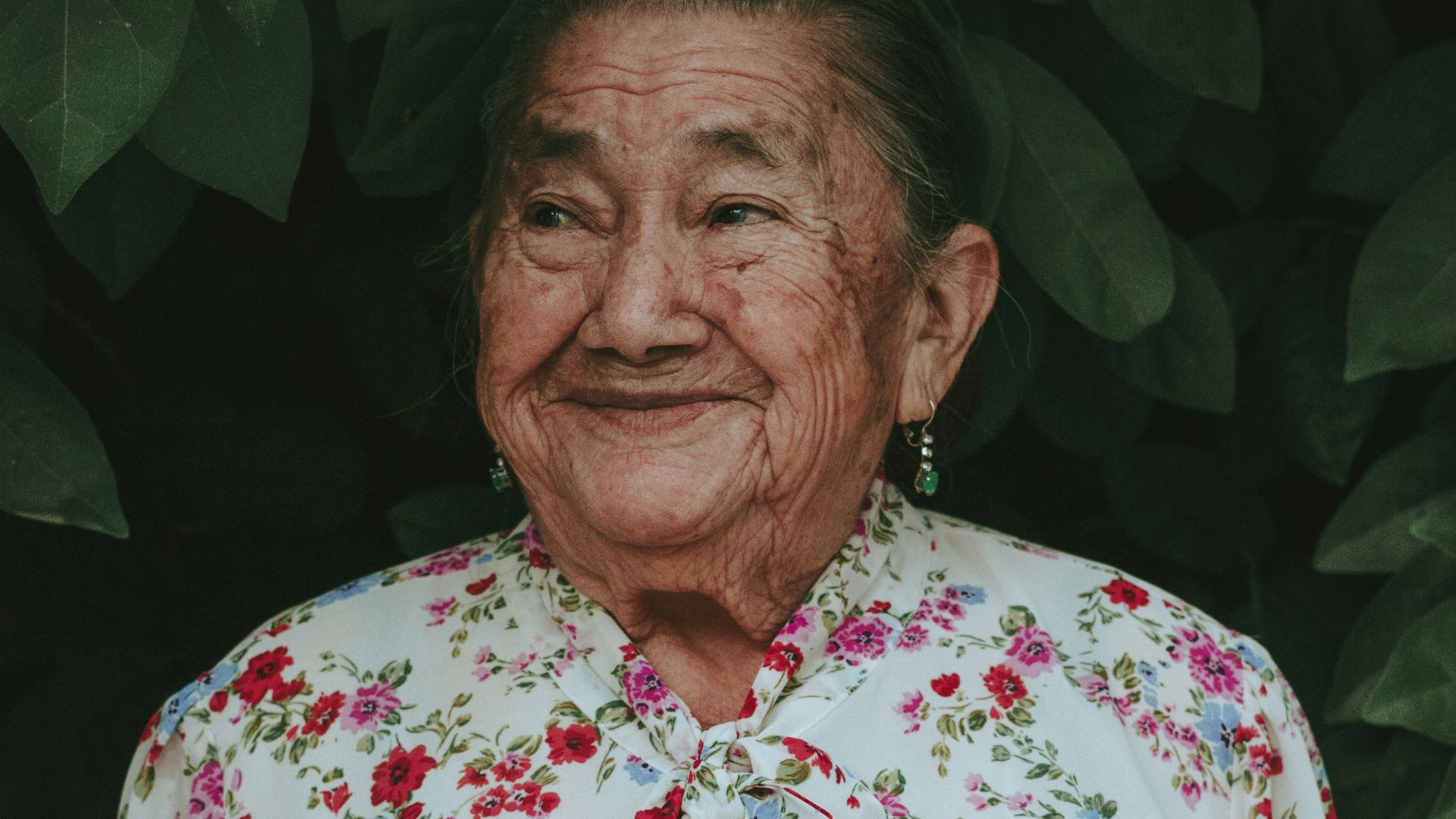 man in white red and blue floral button up shirt