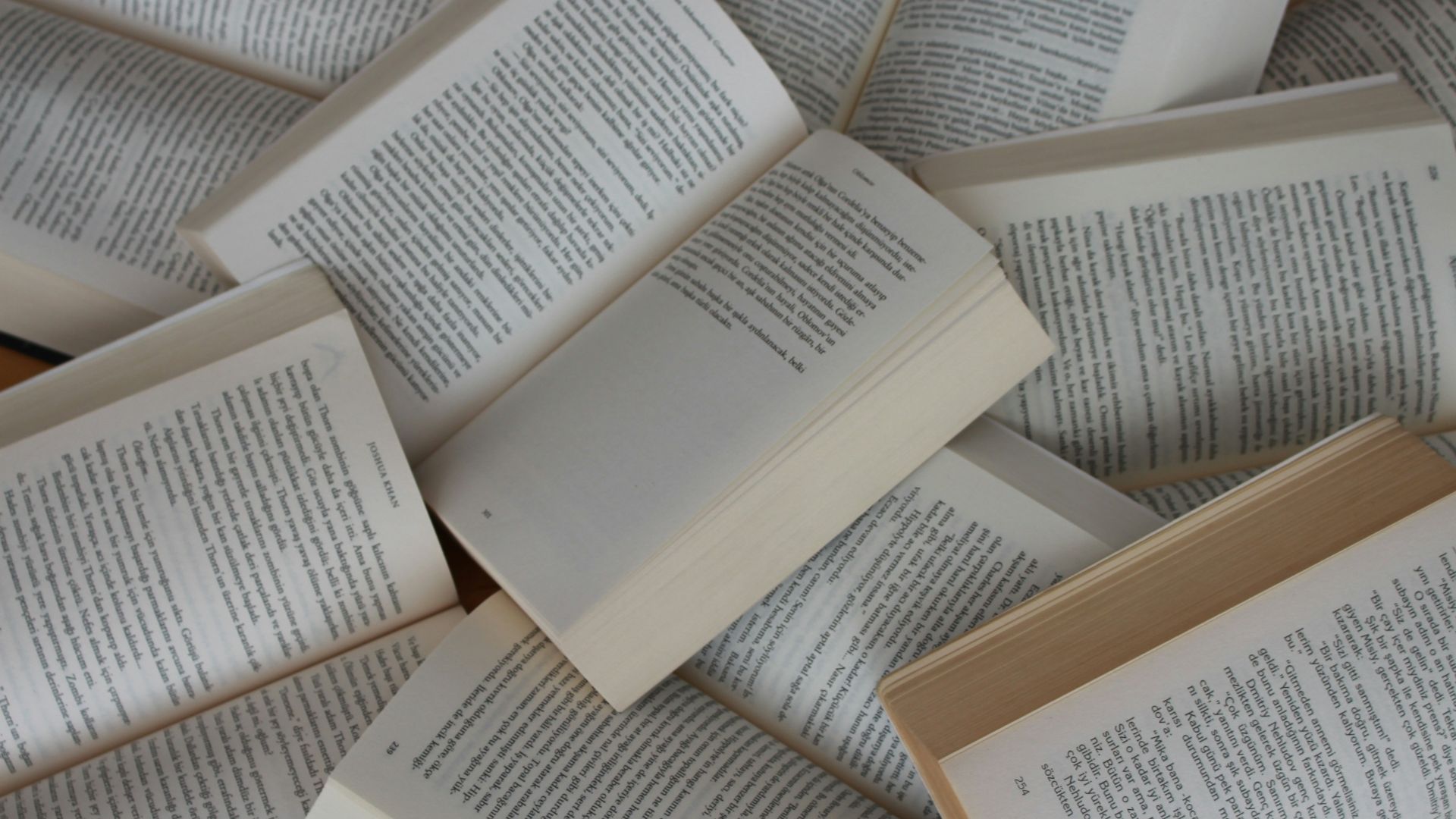 white and brown book on brown woven surface