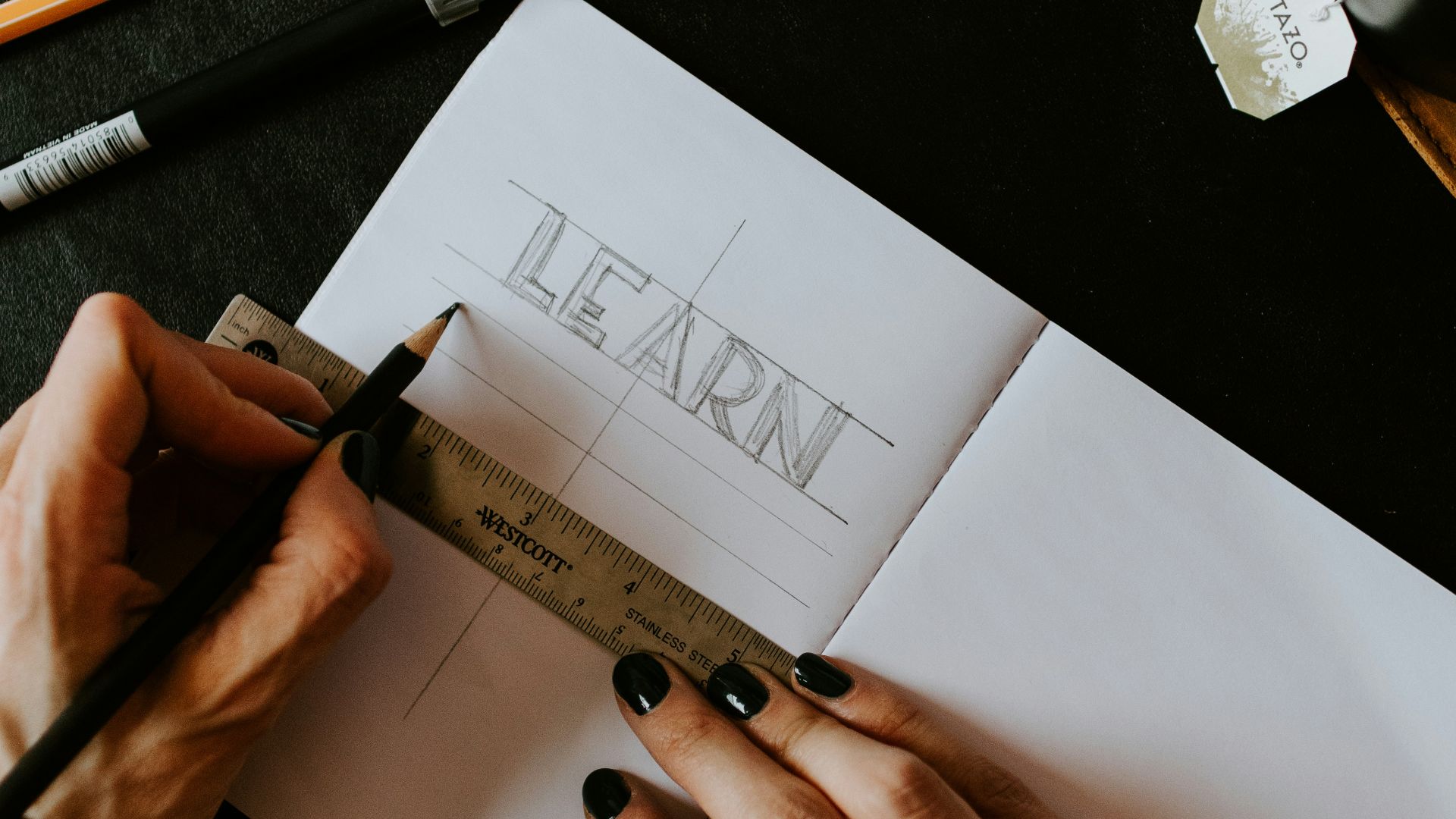 person writing on white paper