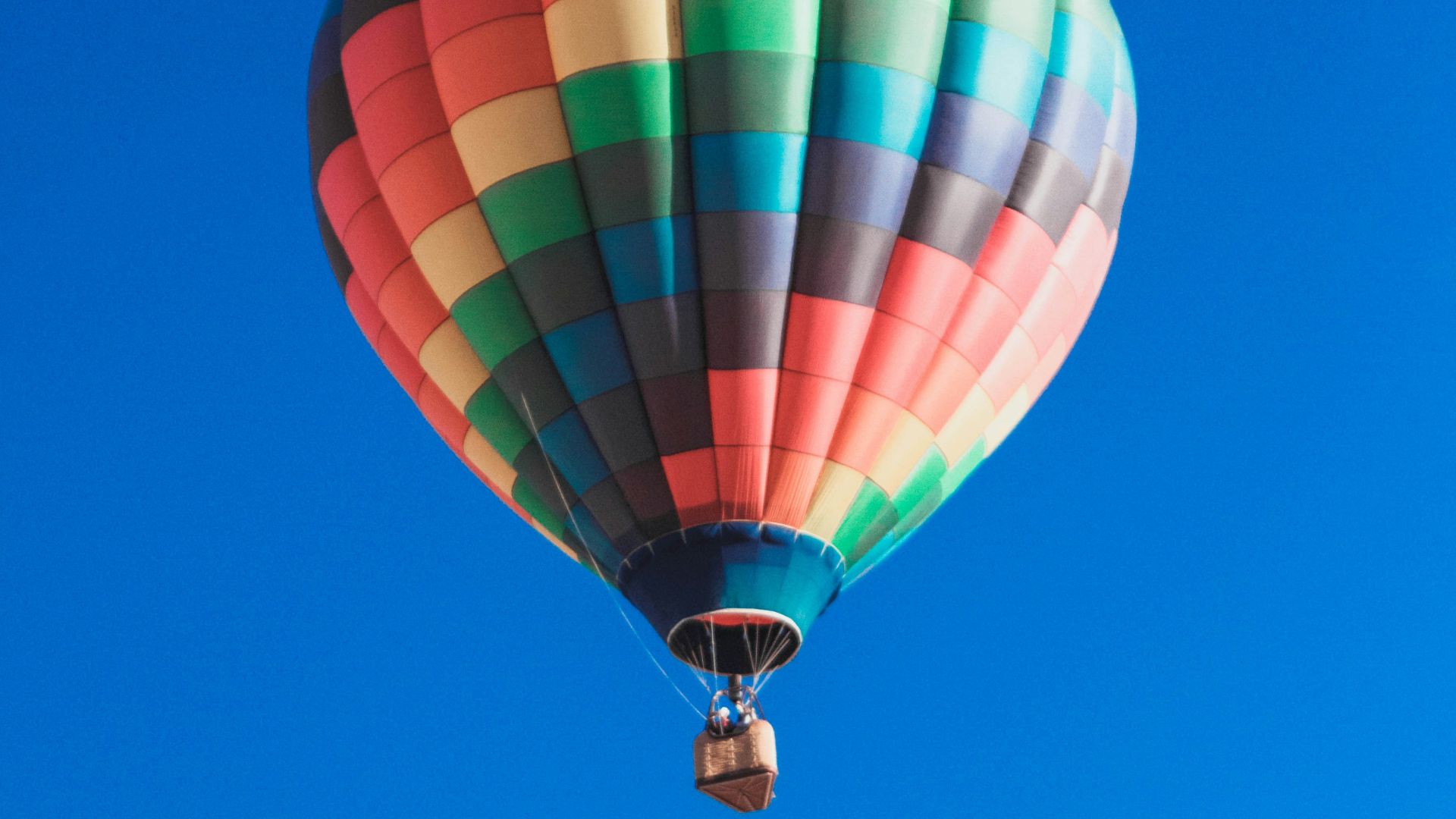 worm's eye view photography of multicolored hot air balloon