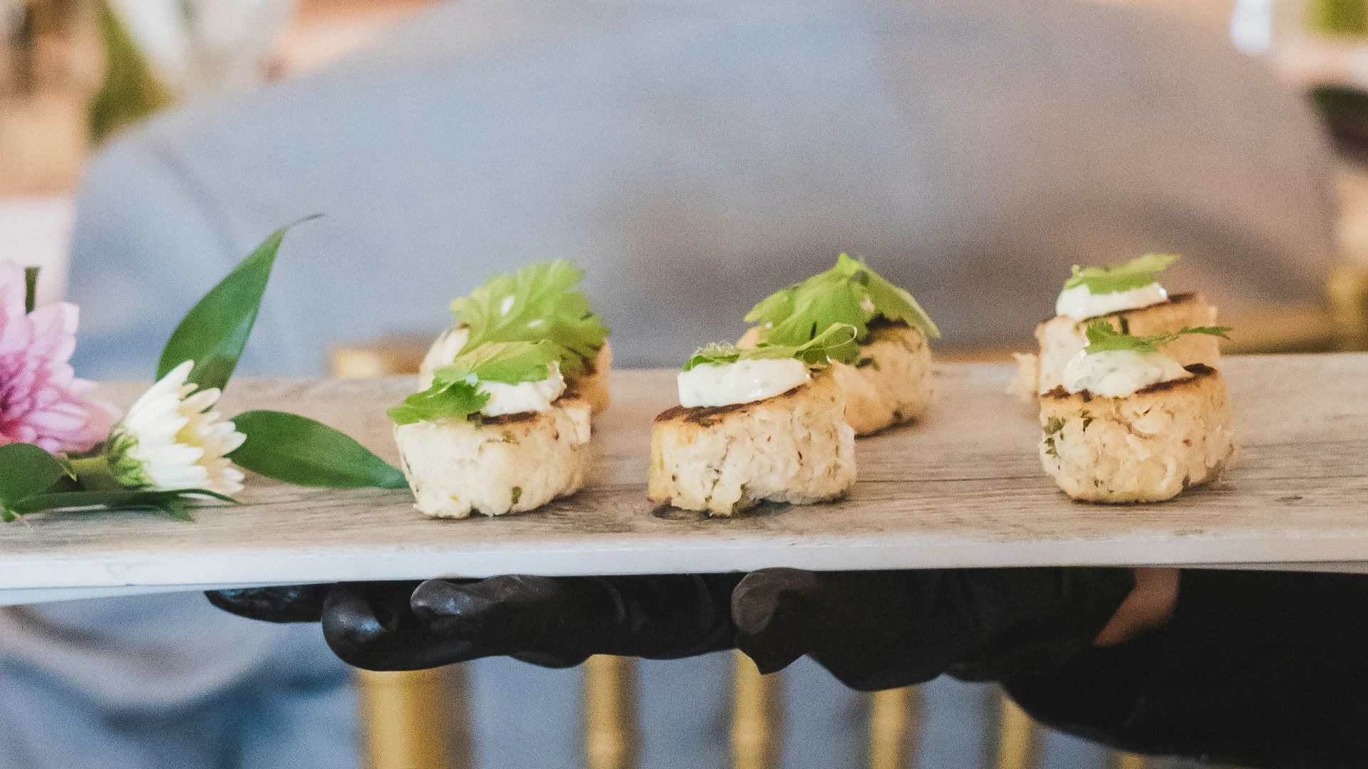 A person holding a tray with food on it