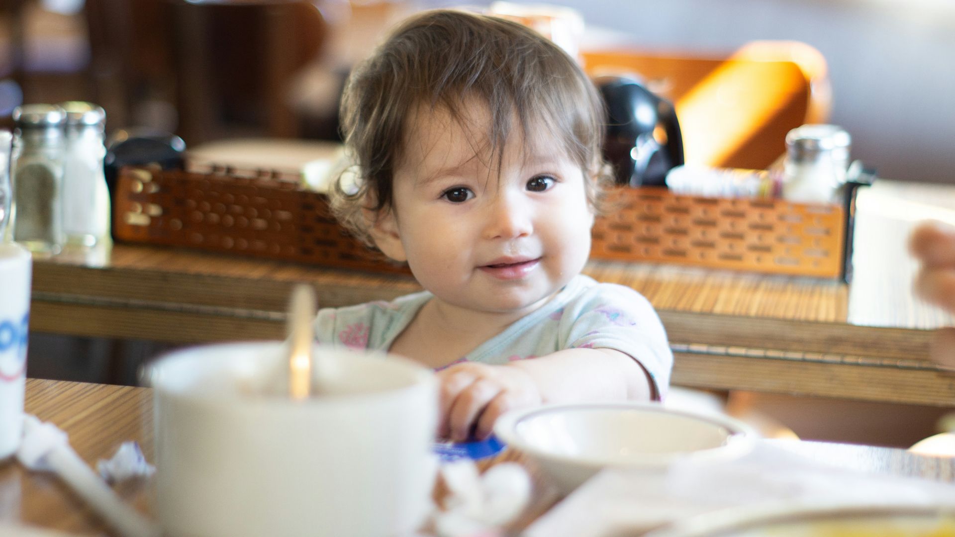 a child sitting at a table