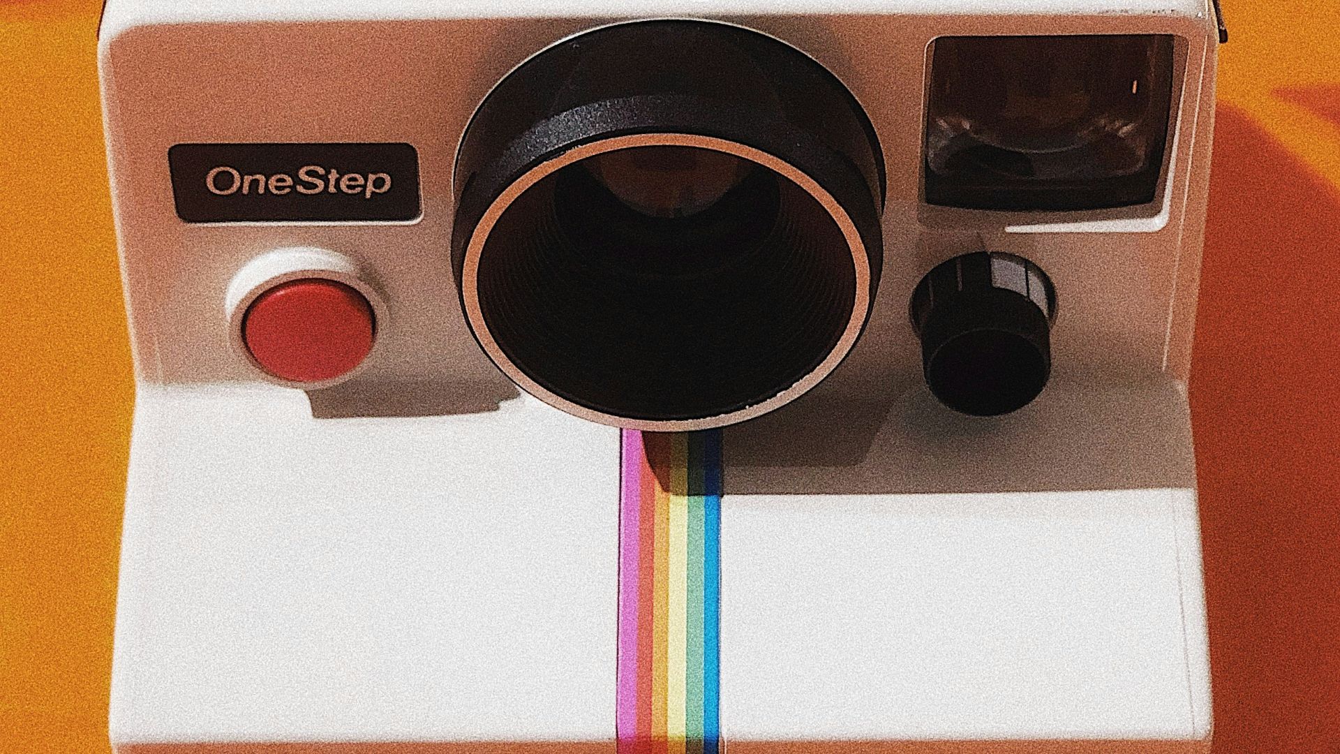 white and black Polaroid OneStep land camera