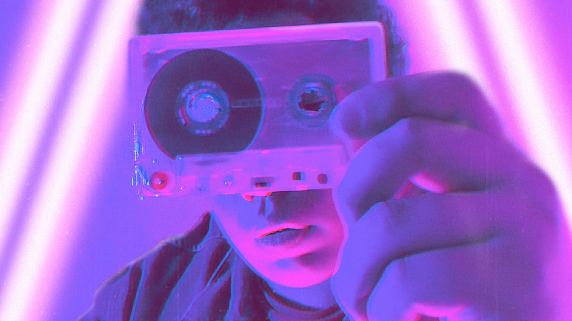 man in white dress shirt holding camera