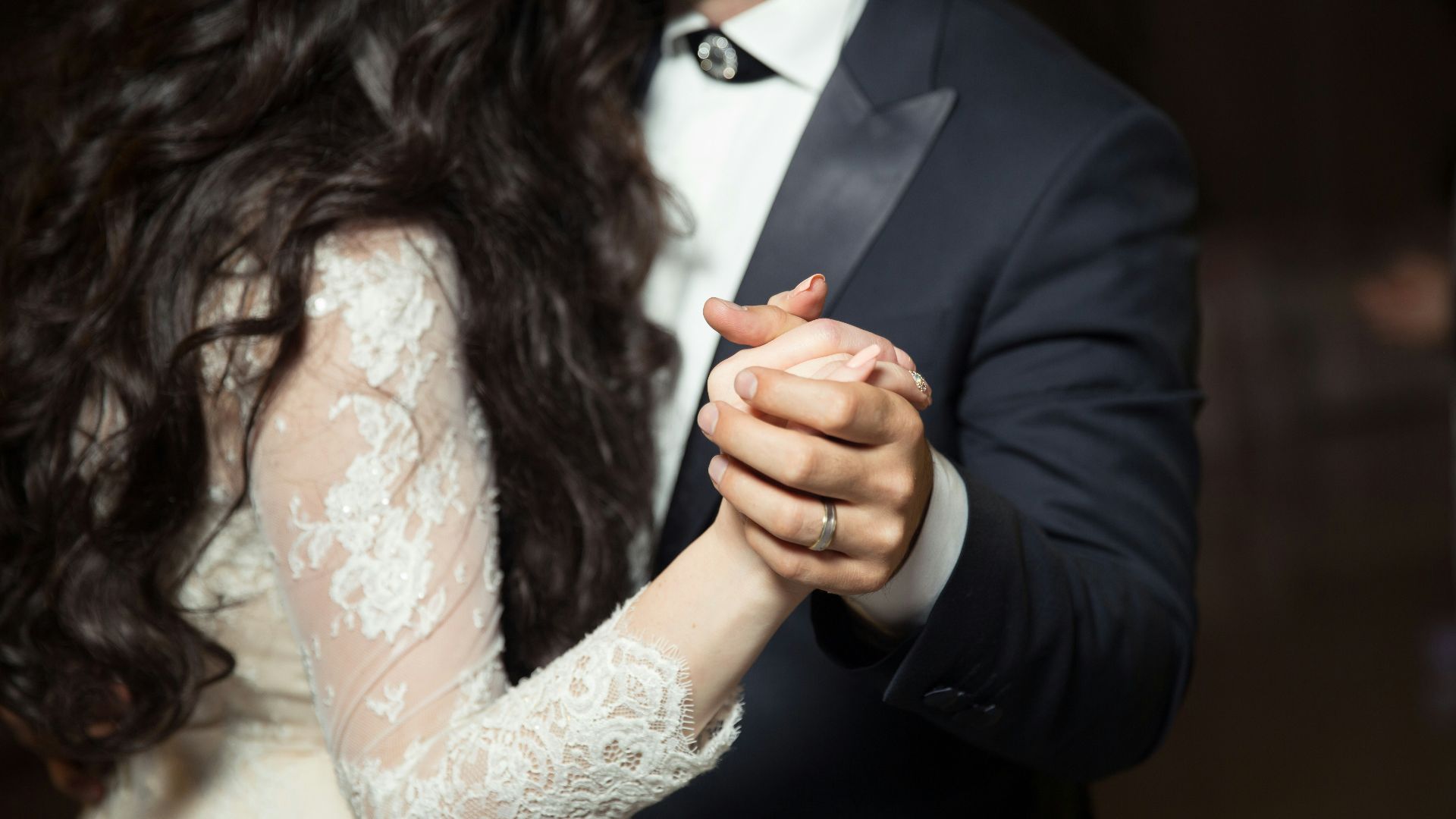 man and woman dancing wearing casual dresses