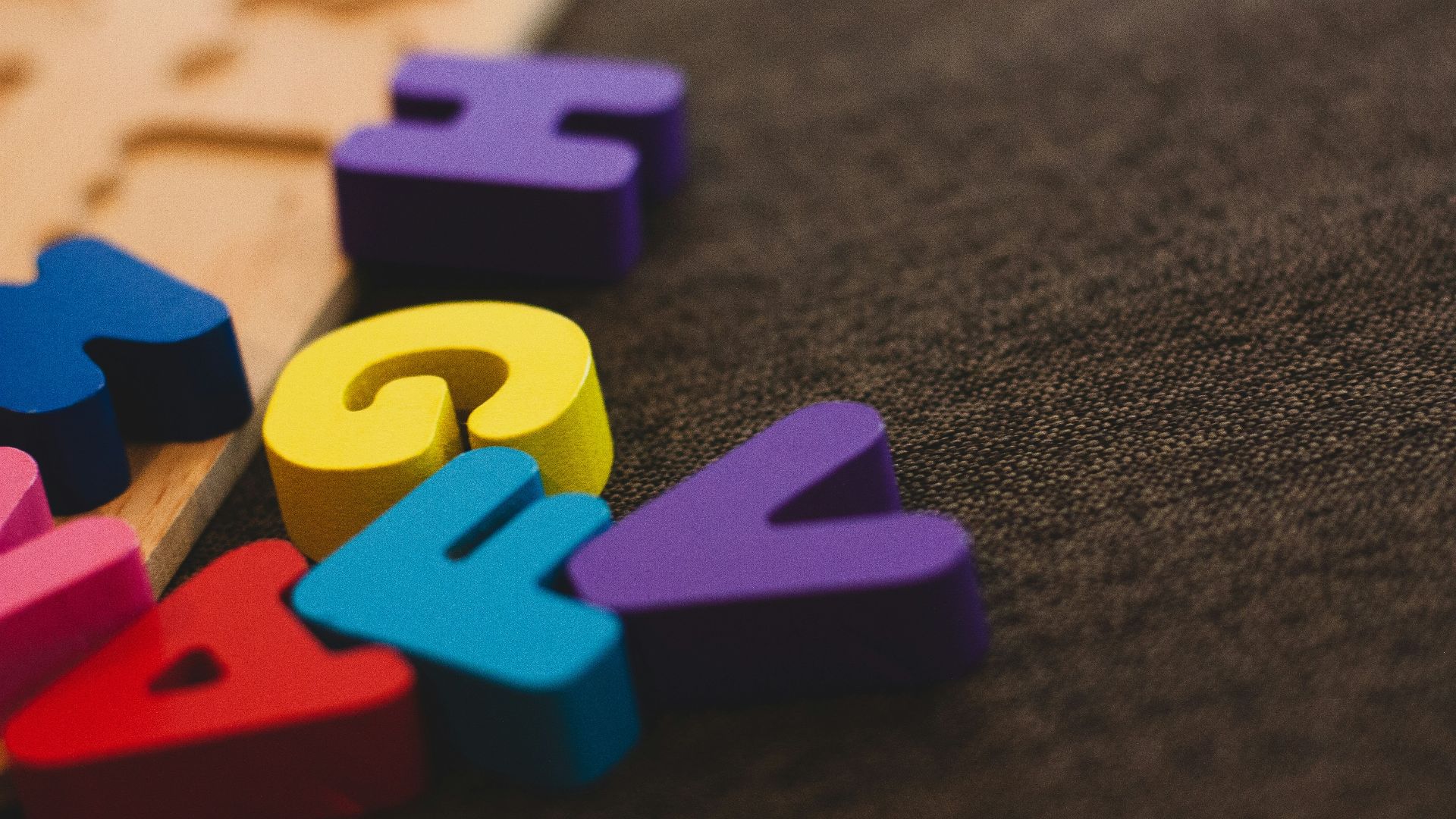 alphabet learning toy on gray apparel