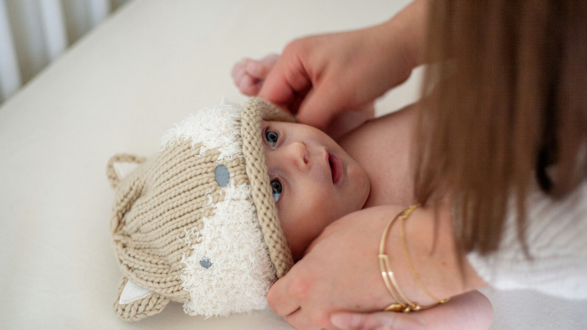 a woman holding a baby in her arms