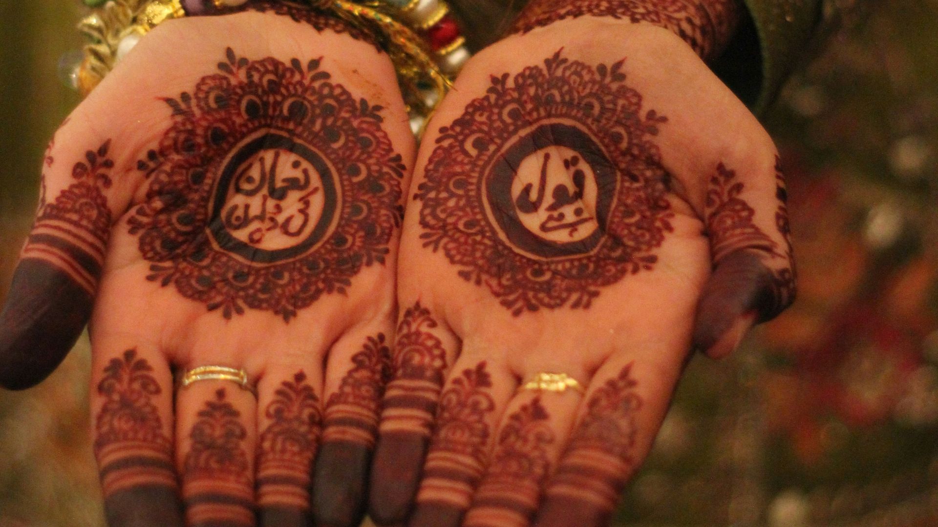 a close up of a person's hands with henna