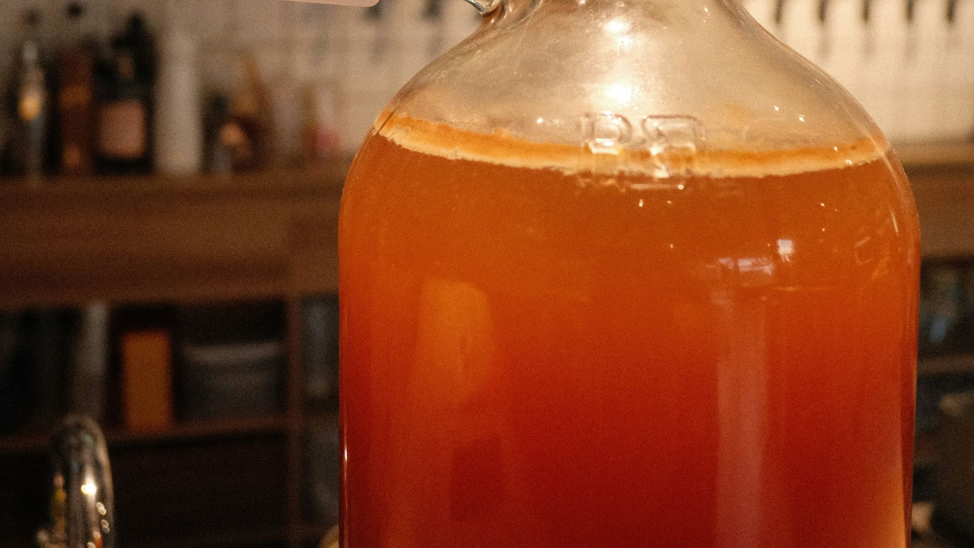 a bottle of liquid sitting on top of a counter
