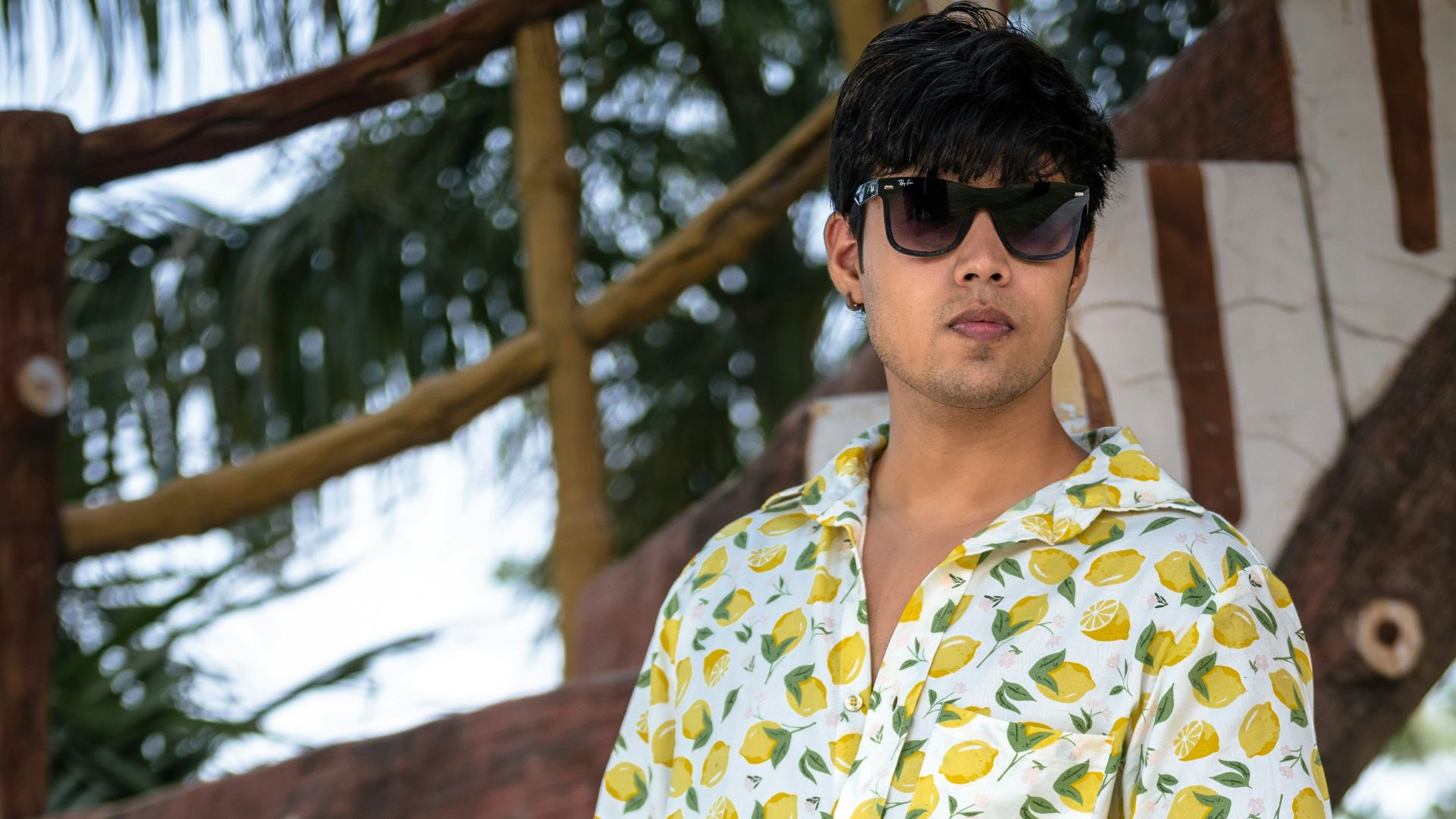 A man in a yellow shirt and brown pants