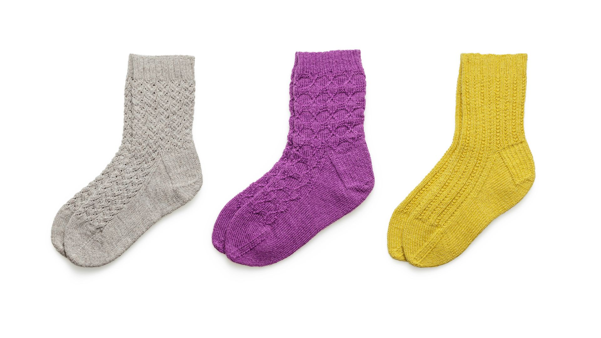 blue and black socks on white background