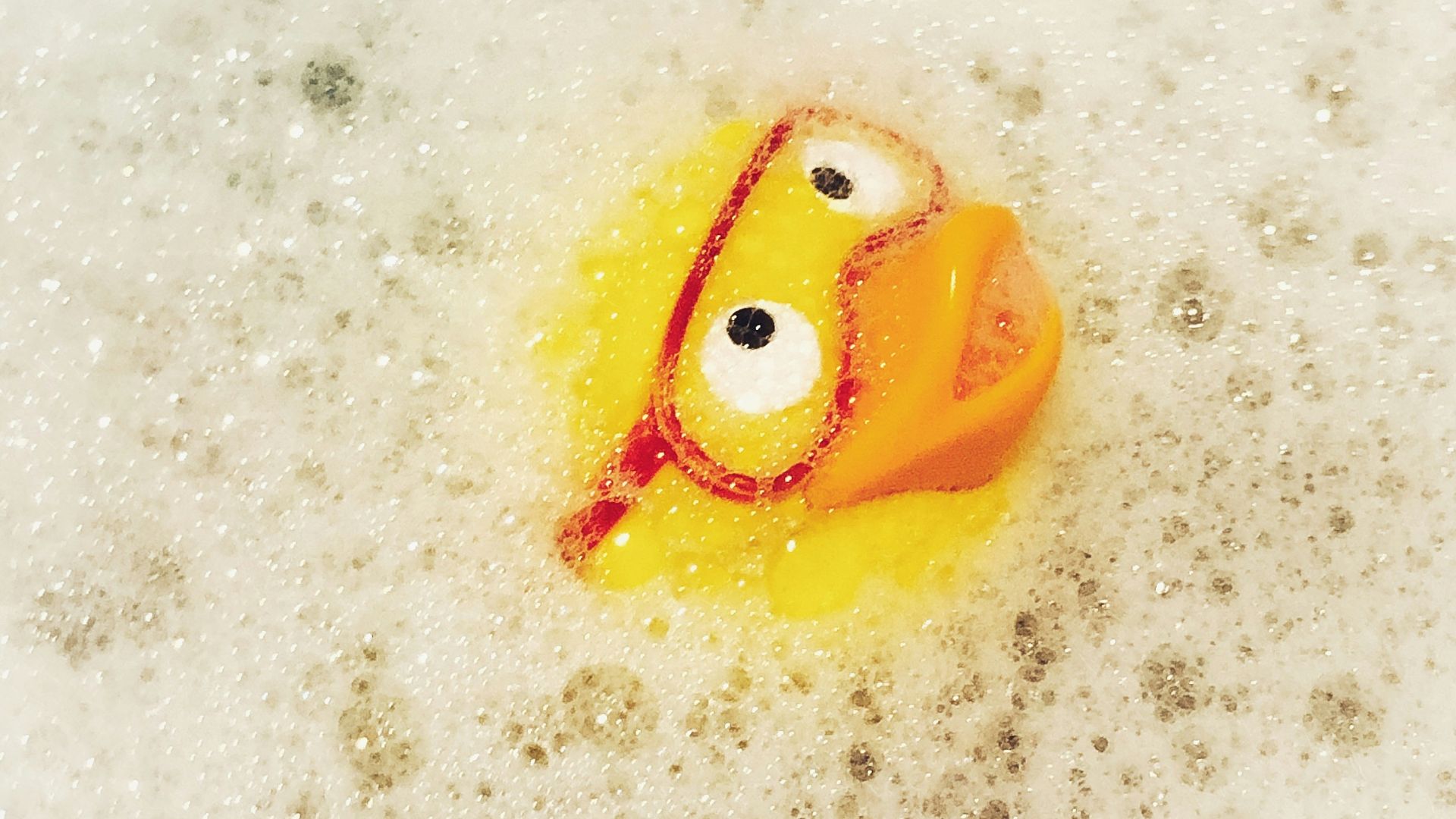 yellow and orange plastic toy