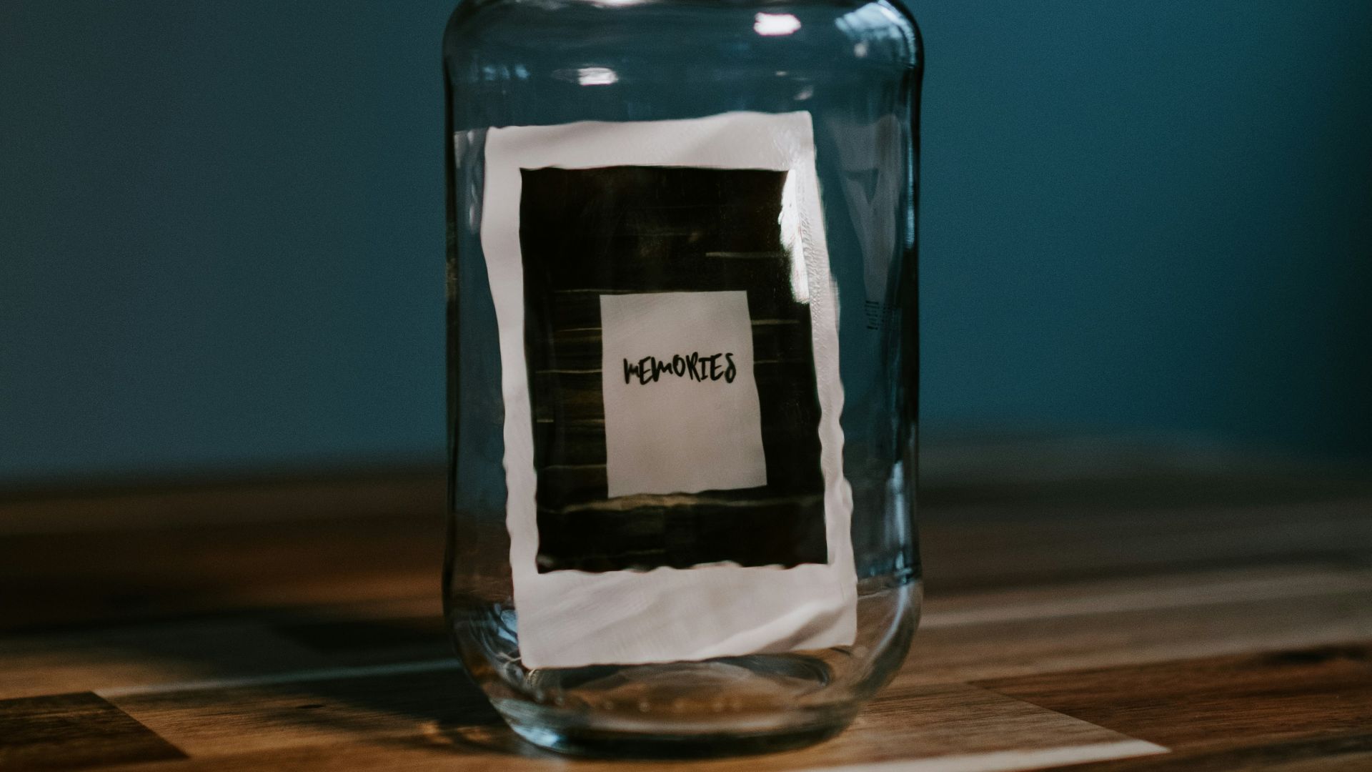 clear glass jar on brown wooden table