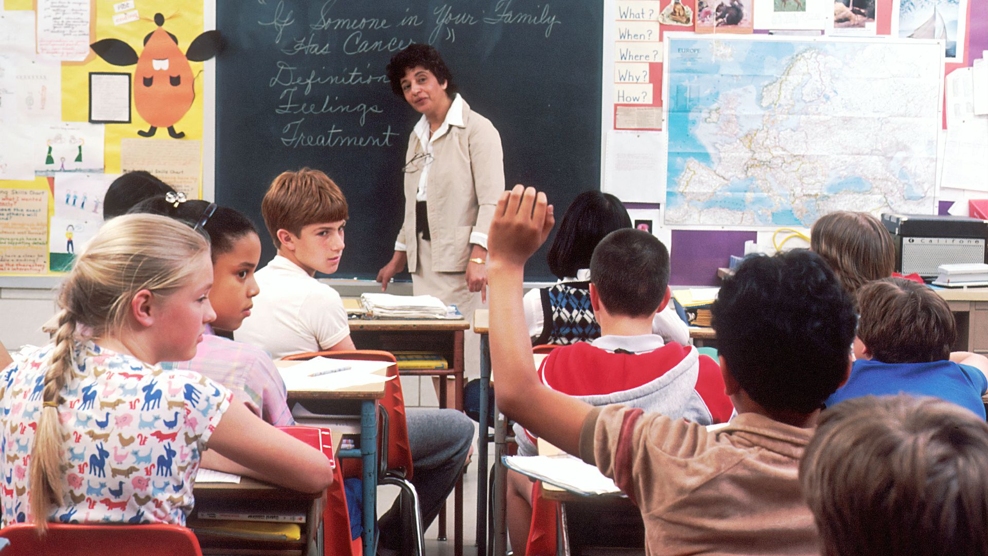 woman standing in front of children