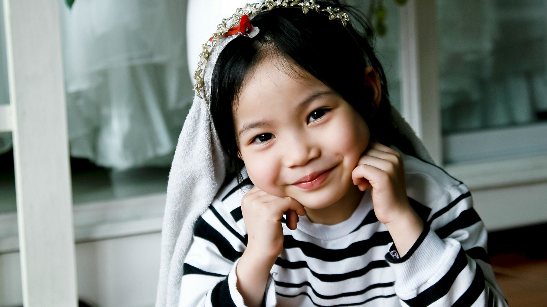 girl in white and black sweater taking photo
