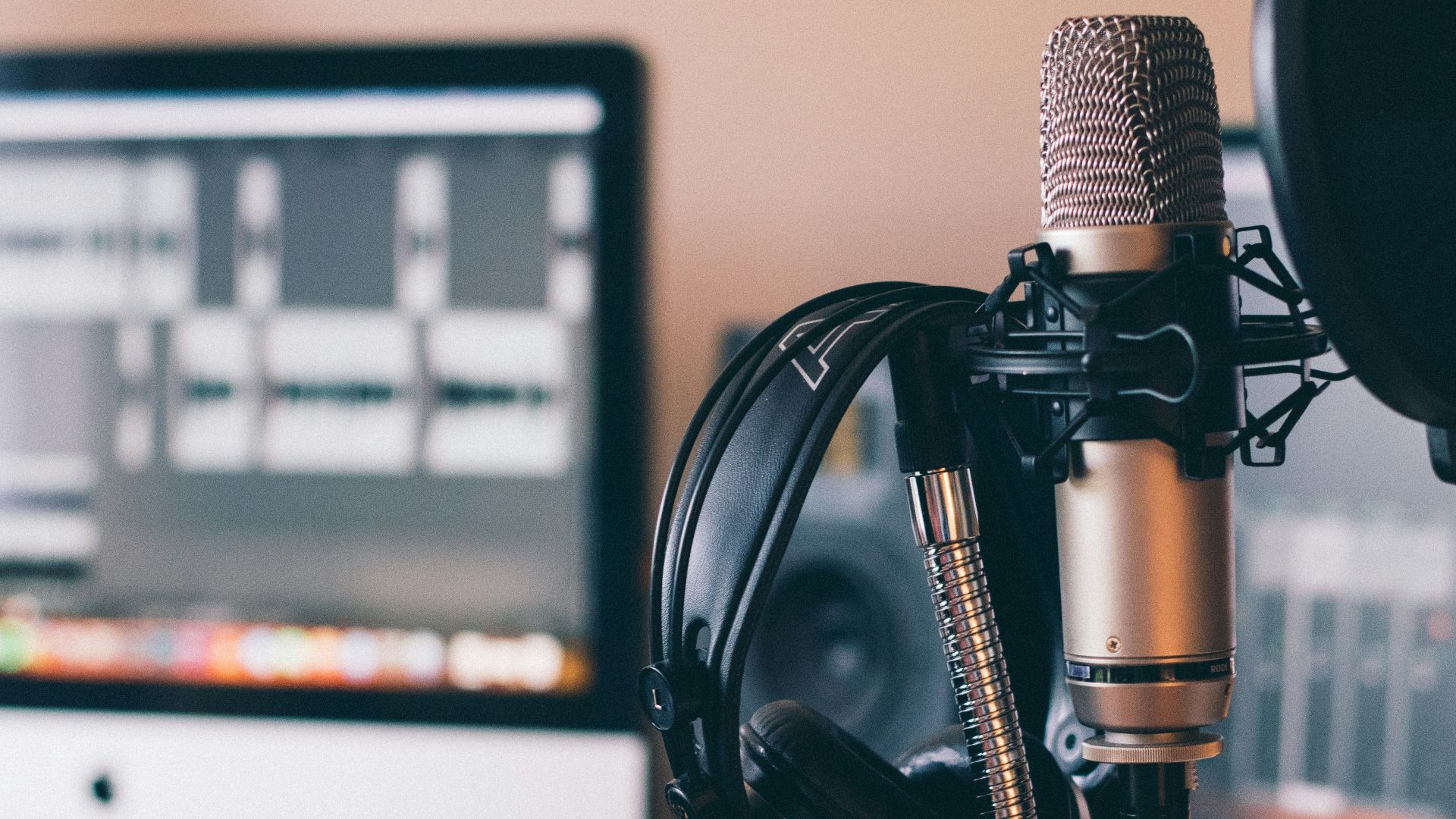 black and silver headphones on black and silver microphone