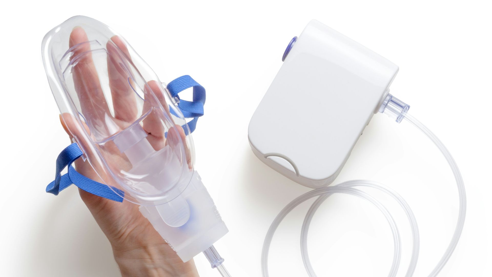 person holding white and blue plastic bottle