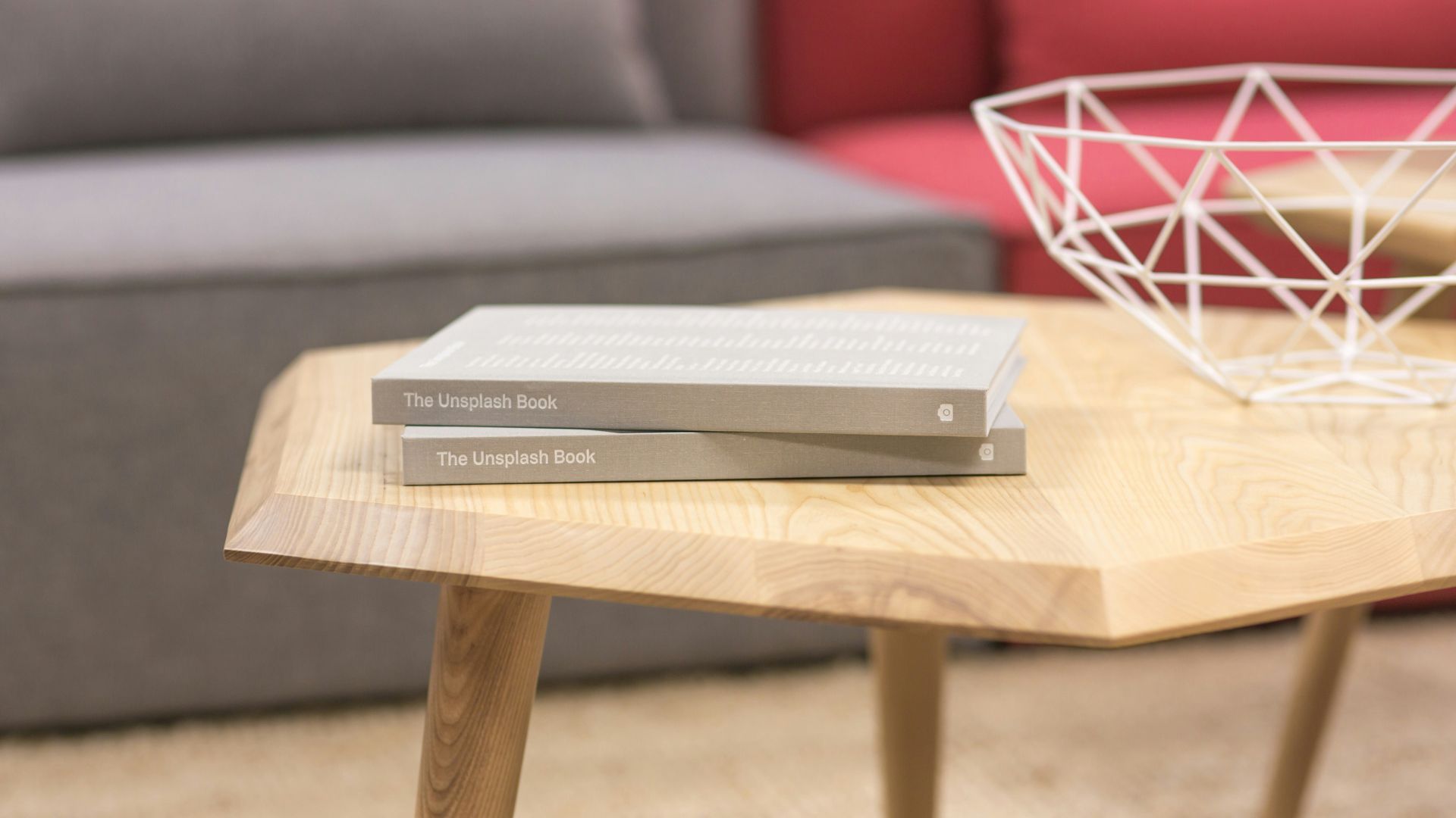 two gray books on brown wooden table