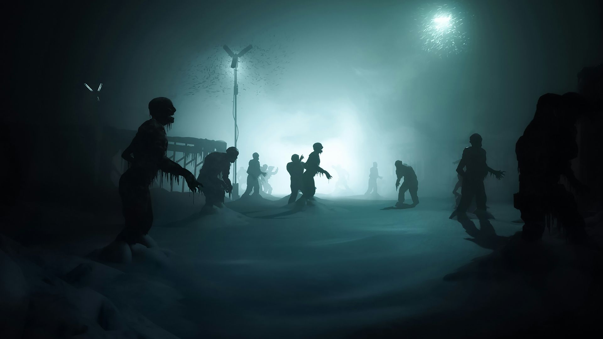 a group of people standing in the snow at night