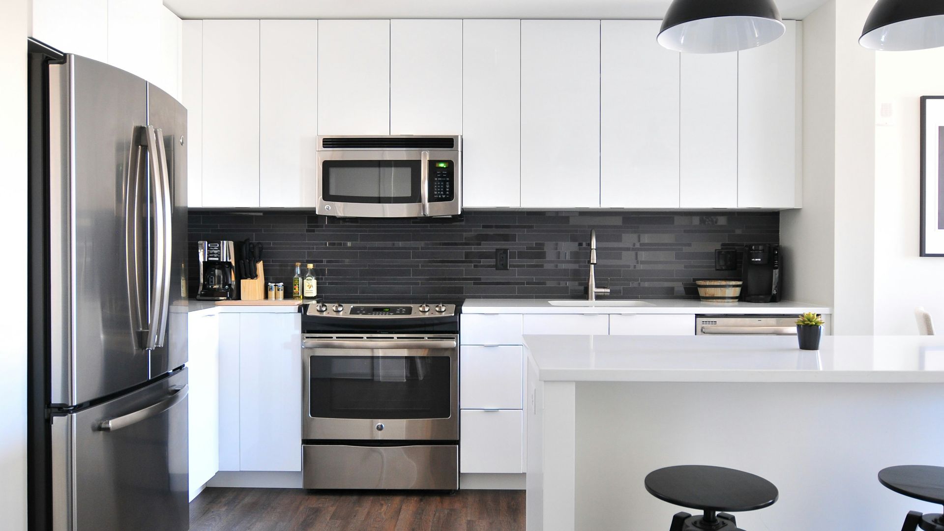 gray steel 3-door refrigerator near modular kitchen