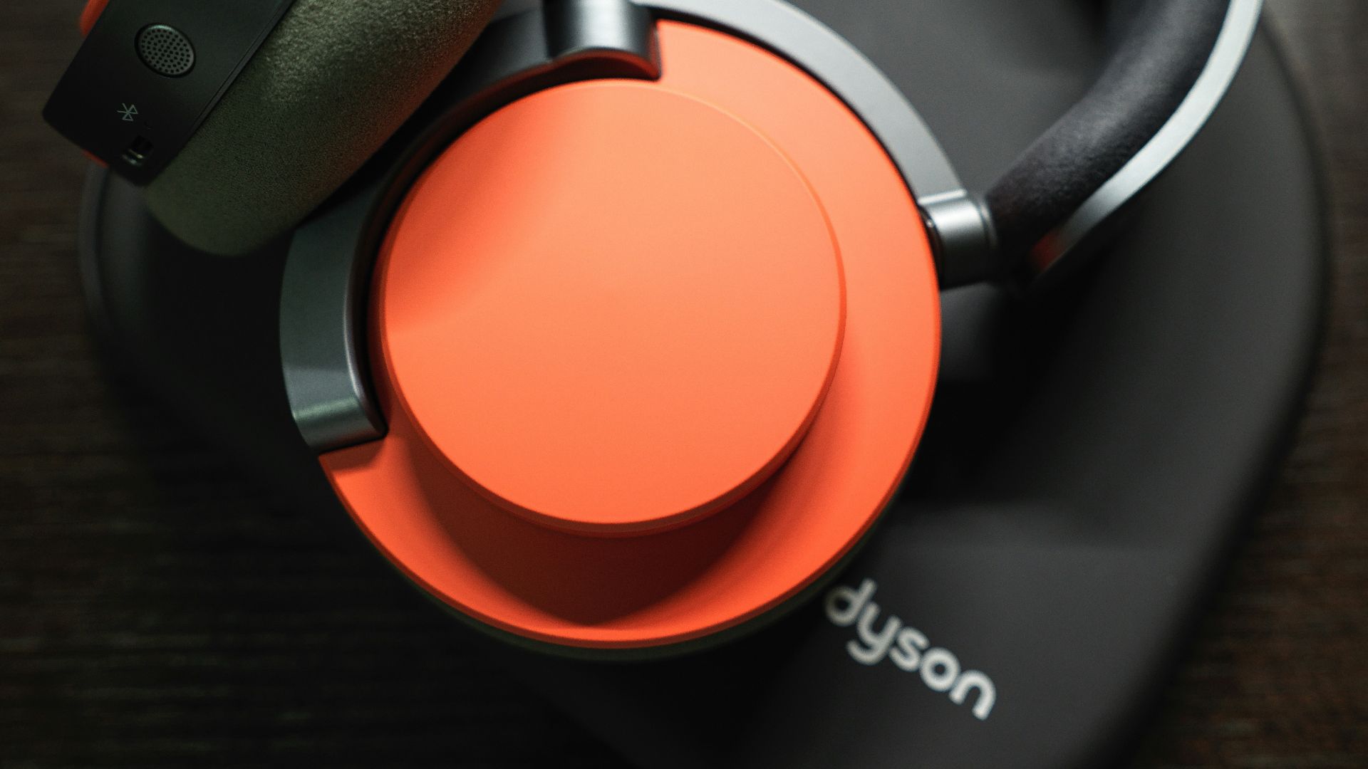 A pair of headphones sitting on top of a wooden table