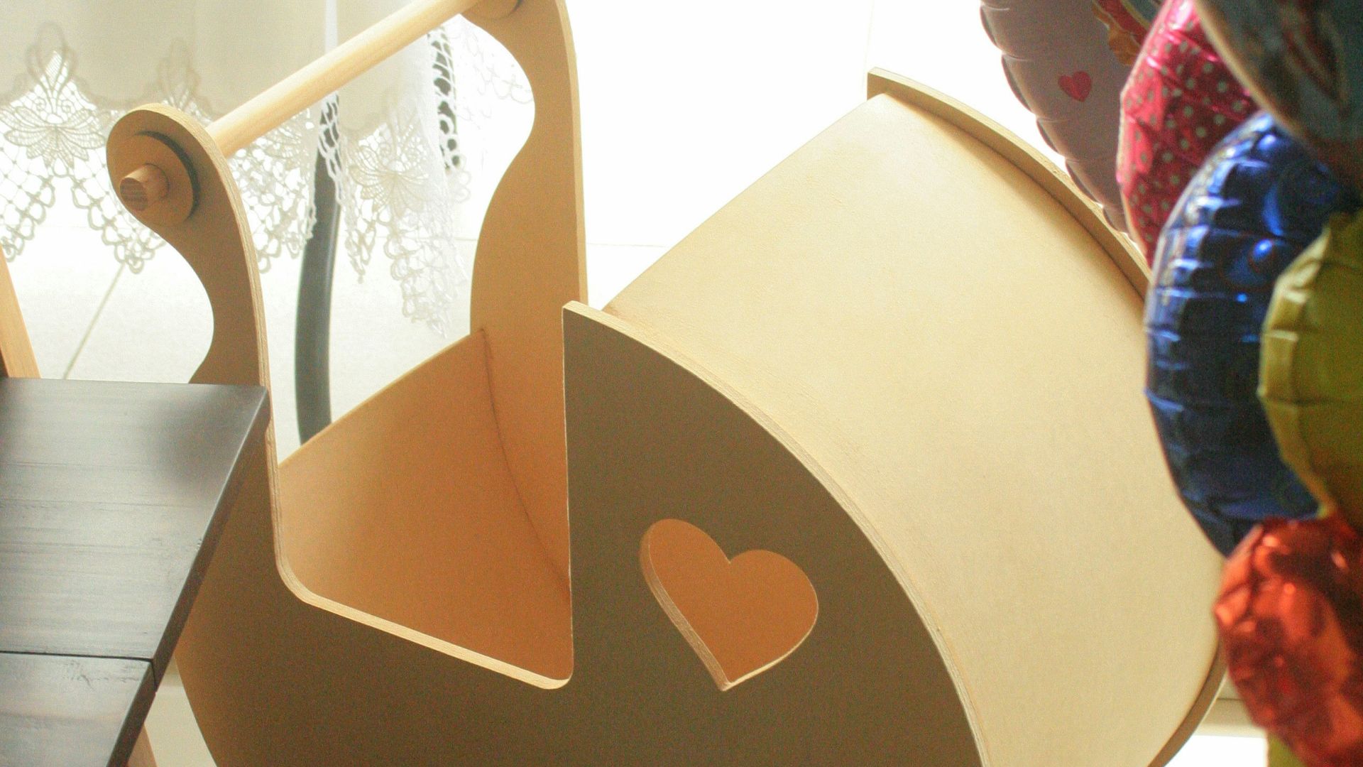 a wooden toy car sitting on top of a table
