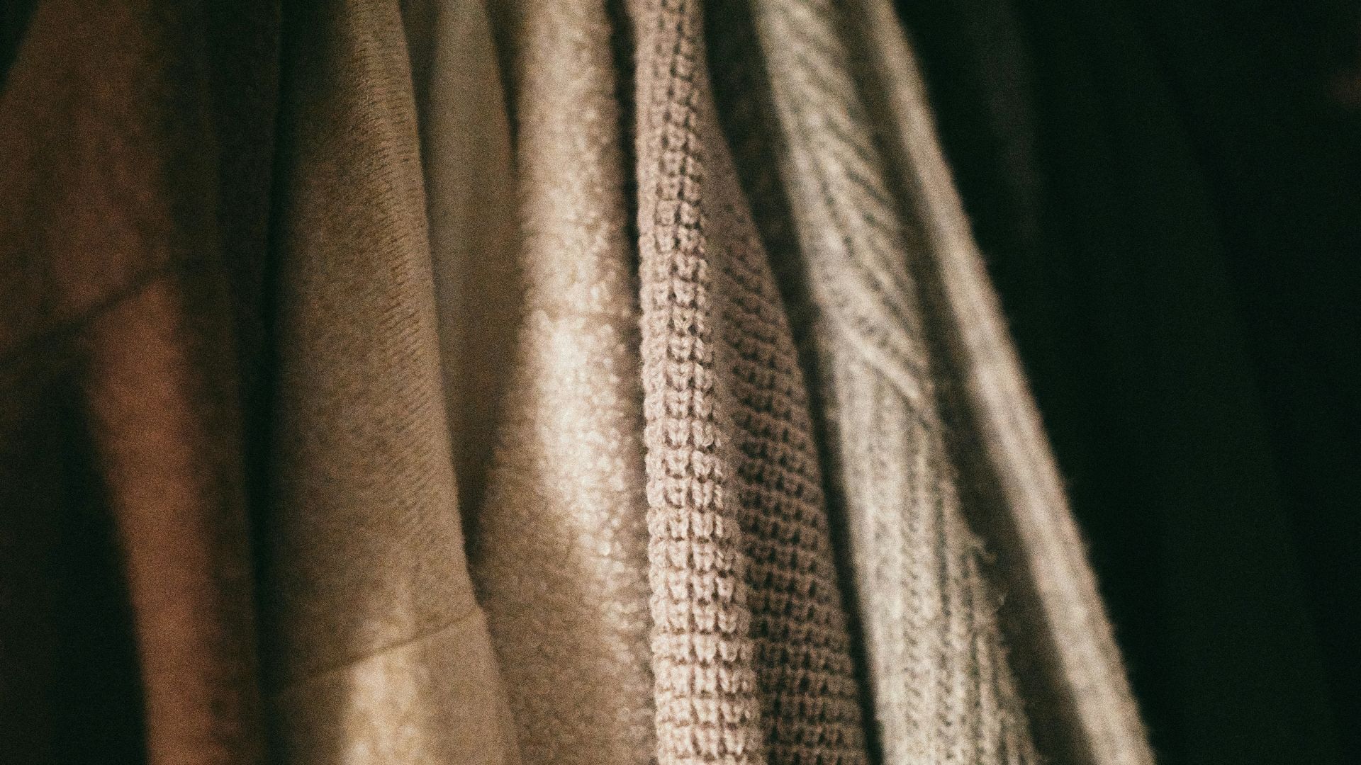 gray and black textile on black textile