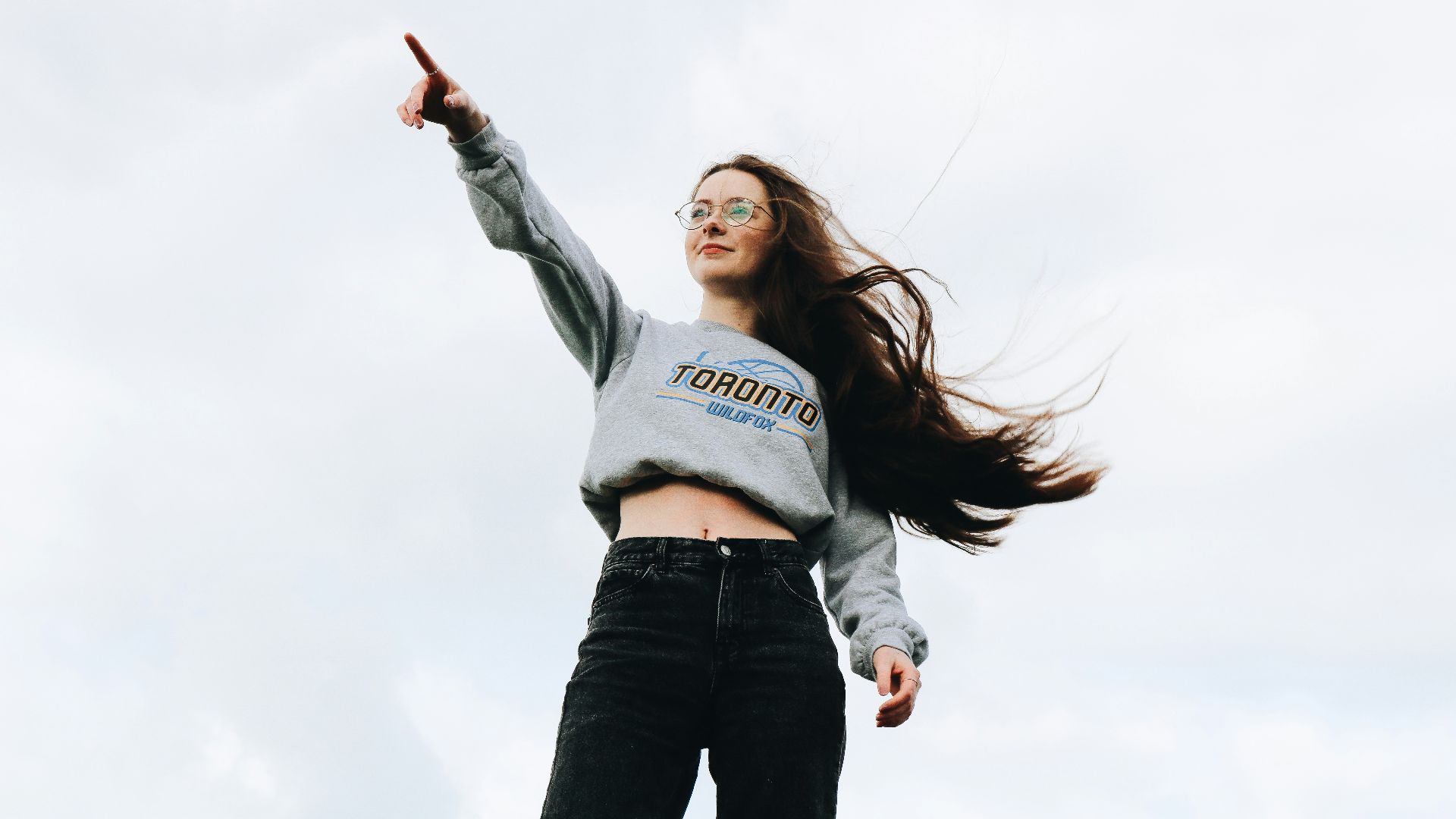 woman pointing using her right hand