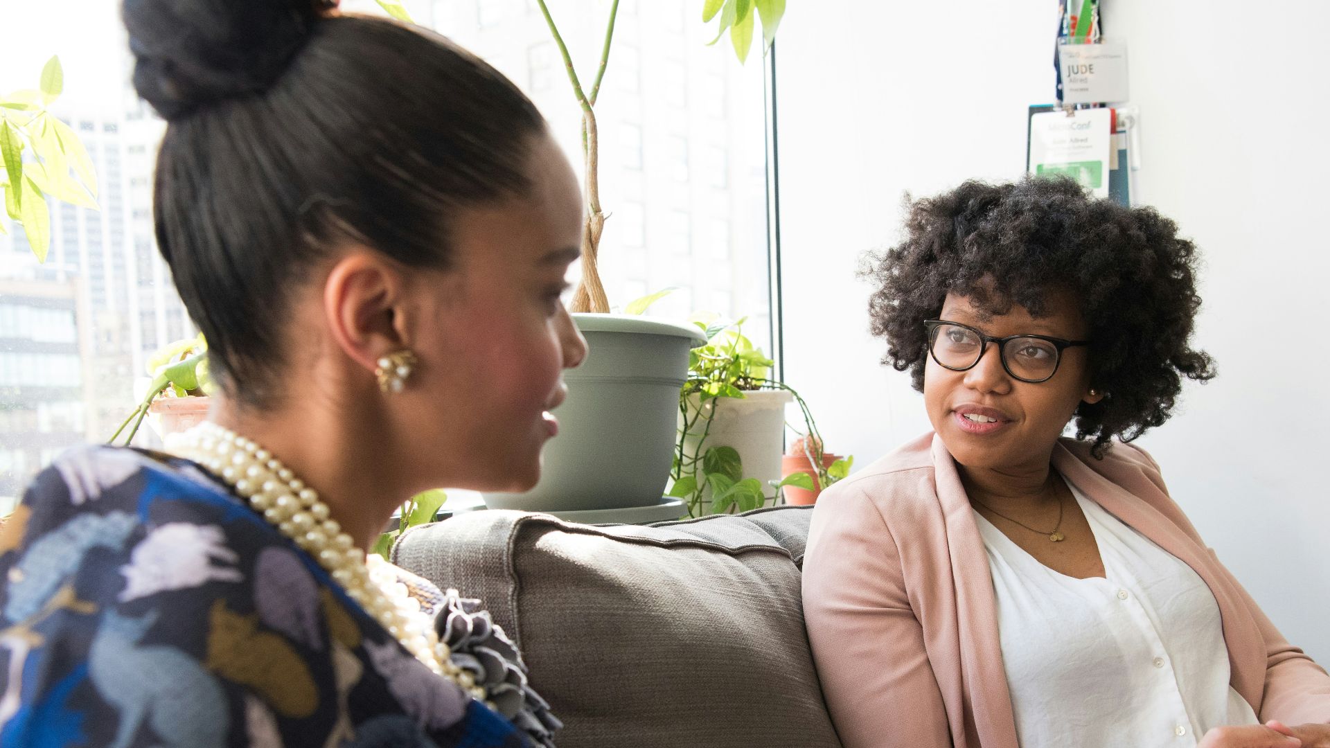shallow focus photo of woman in beige open cardigan